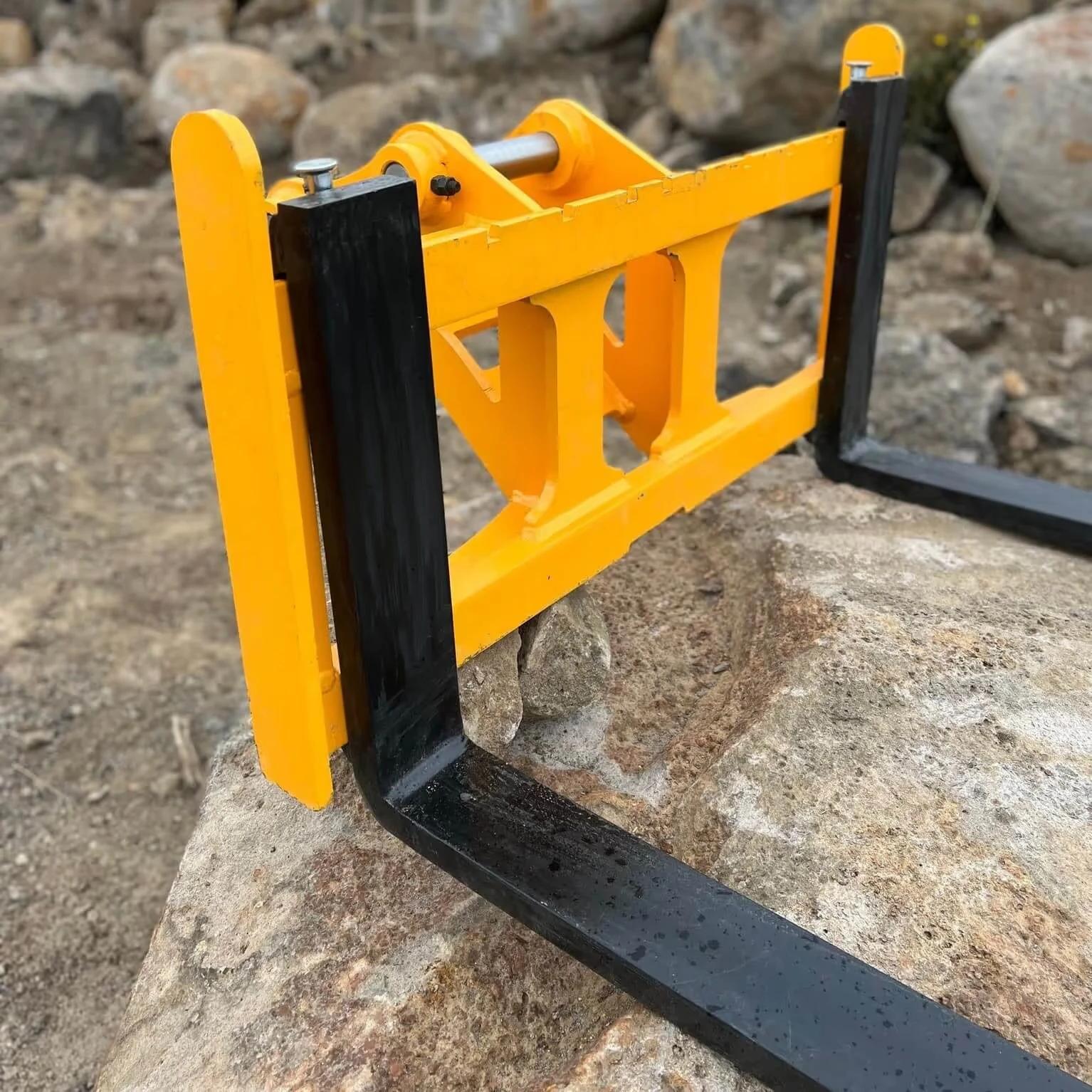 Excavator Pallet Fork Attachment on rock surface