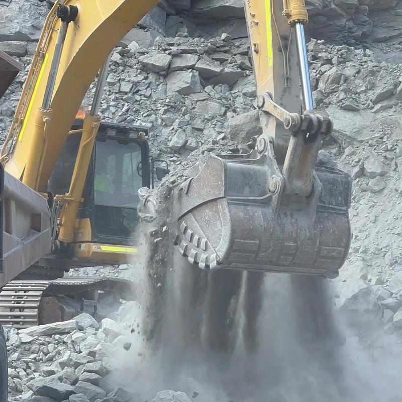 Excavator rock bucket working in hard rock