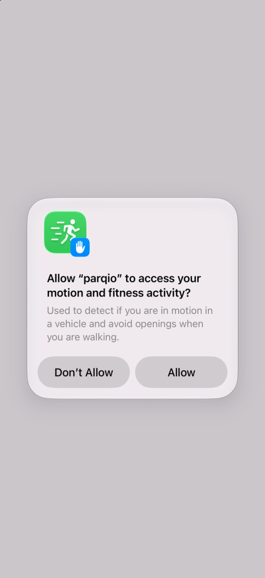 The iPhone asks whether Parqio may access your motion and fitness activity, with “Don’t Allow” and “Allow”