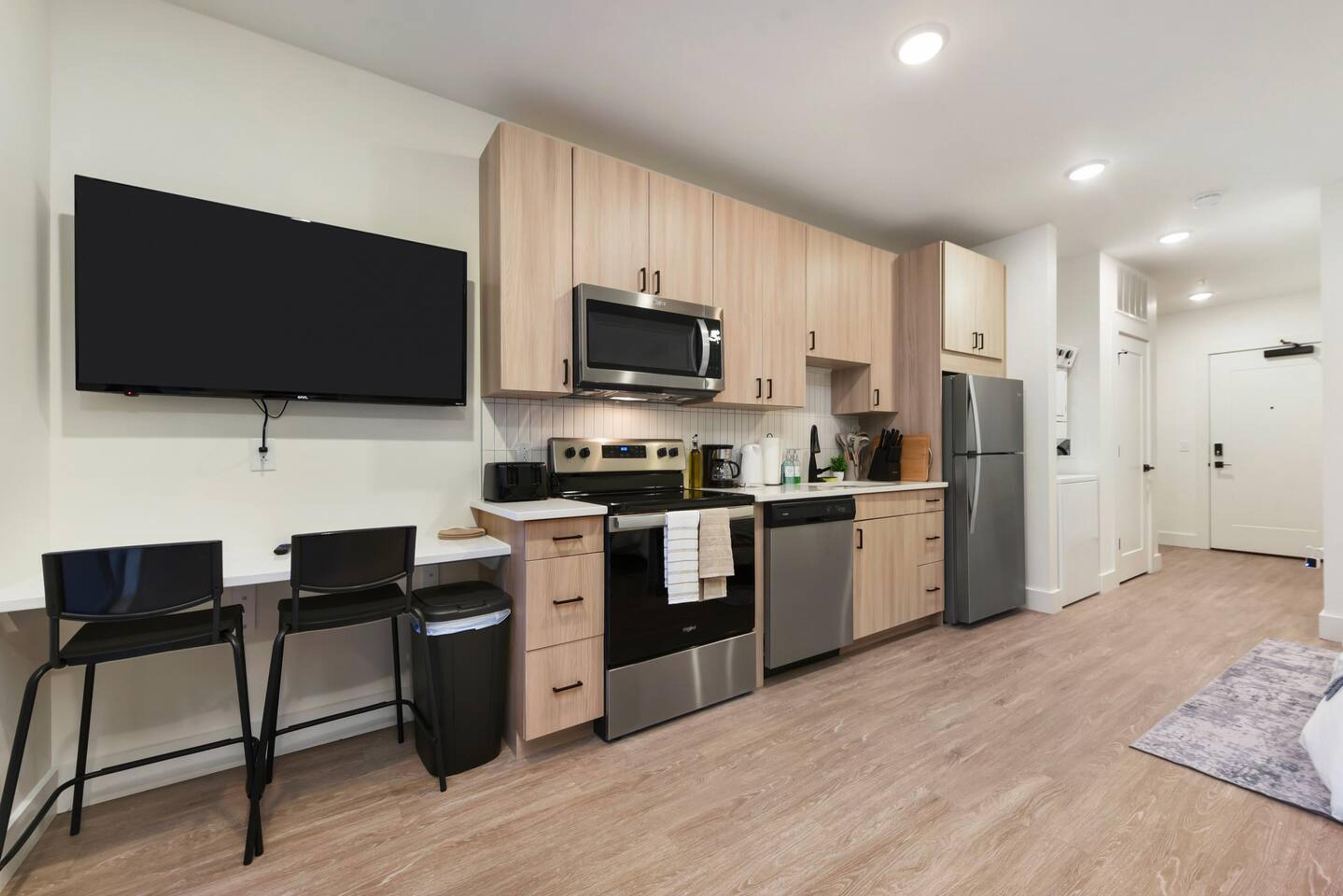 Bright, spacious kitchen perfect for cooking and dining. Fully equipped with everything you need for a comfortable stay.