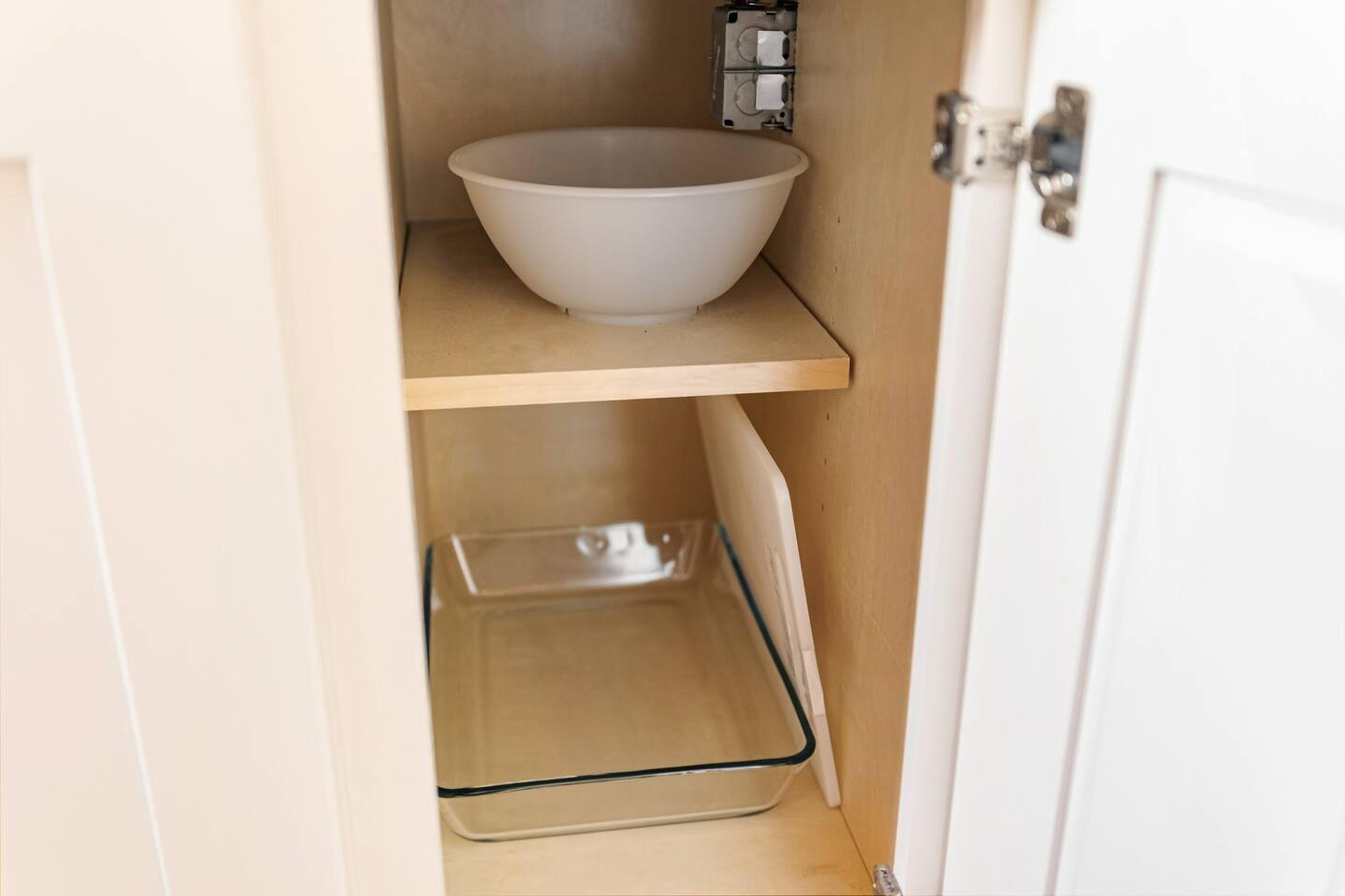 Cabinet with glassware in kitchen area.