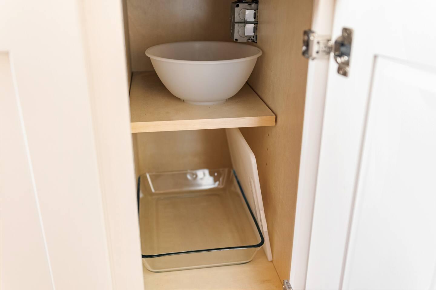 Cabinet with glassware in kitchen area.