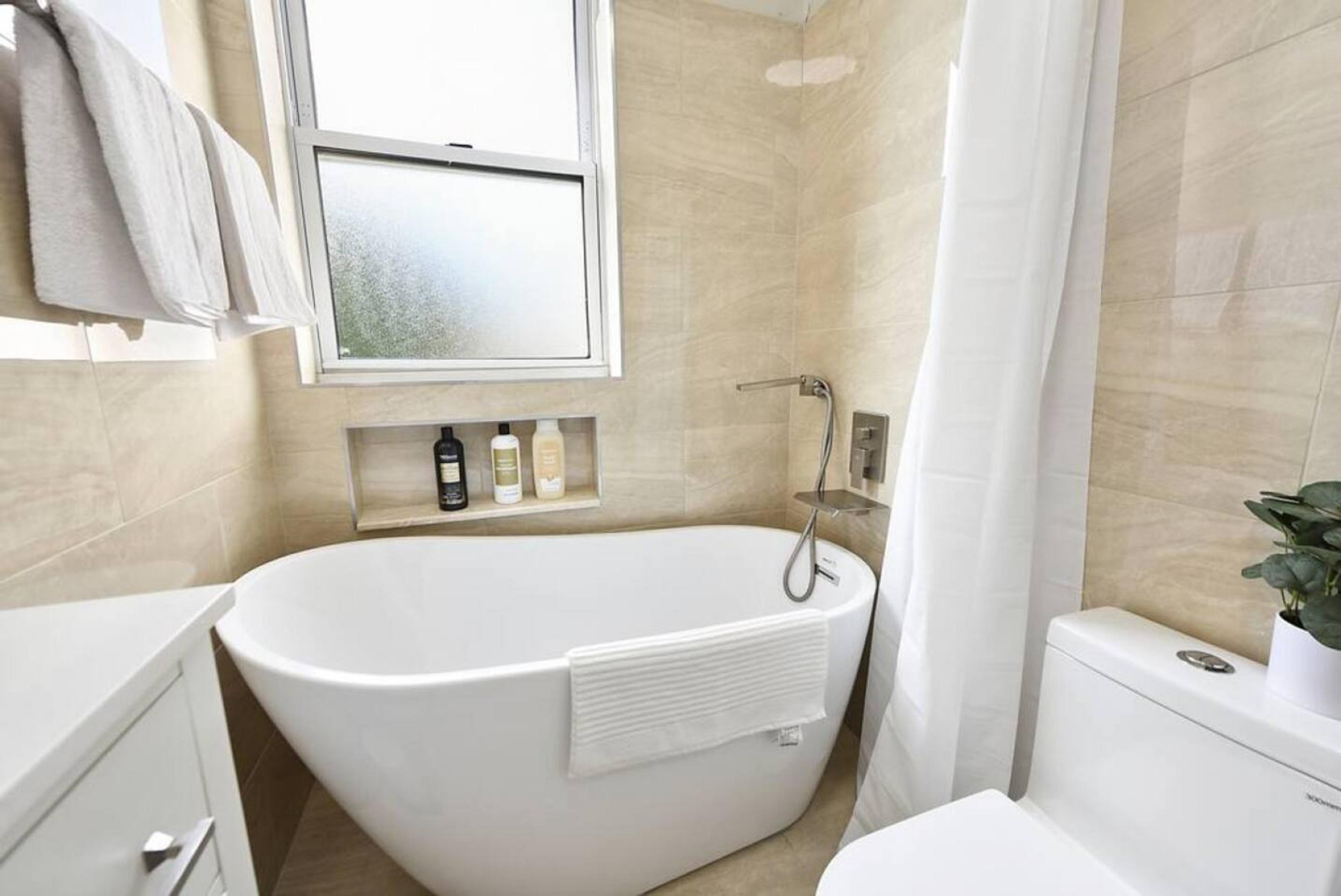 Bathroom 2 : 
Indulge in Serenity and Comfort in Our Bathroom Retreat with a Captivating Bathtub