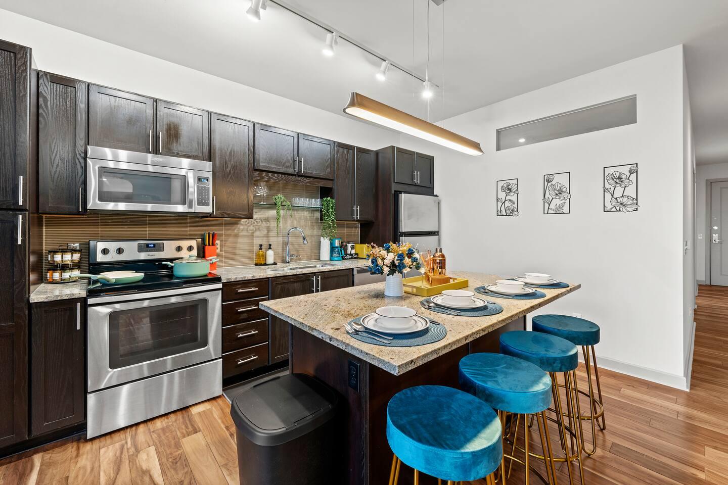Fully equipped Kitchen: Kettle, knife set, coffee maker, cutting board, blender, electric stove, microwave, oven, spatulas, whiskers, toaster, stainless steel appliances and also fully stocked cabinets with cleaning amenities.