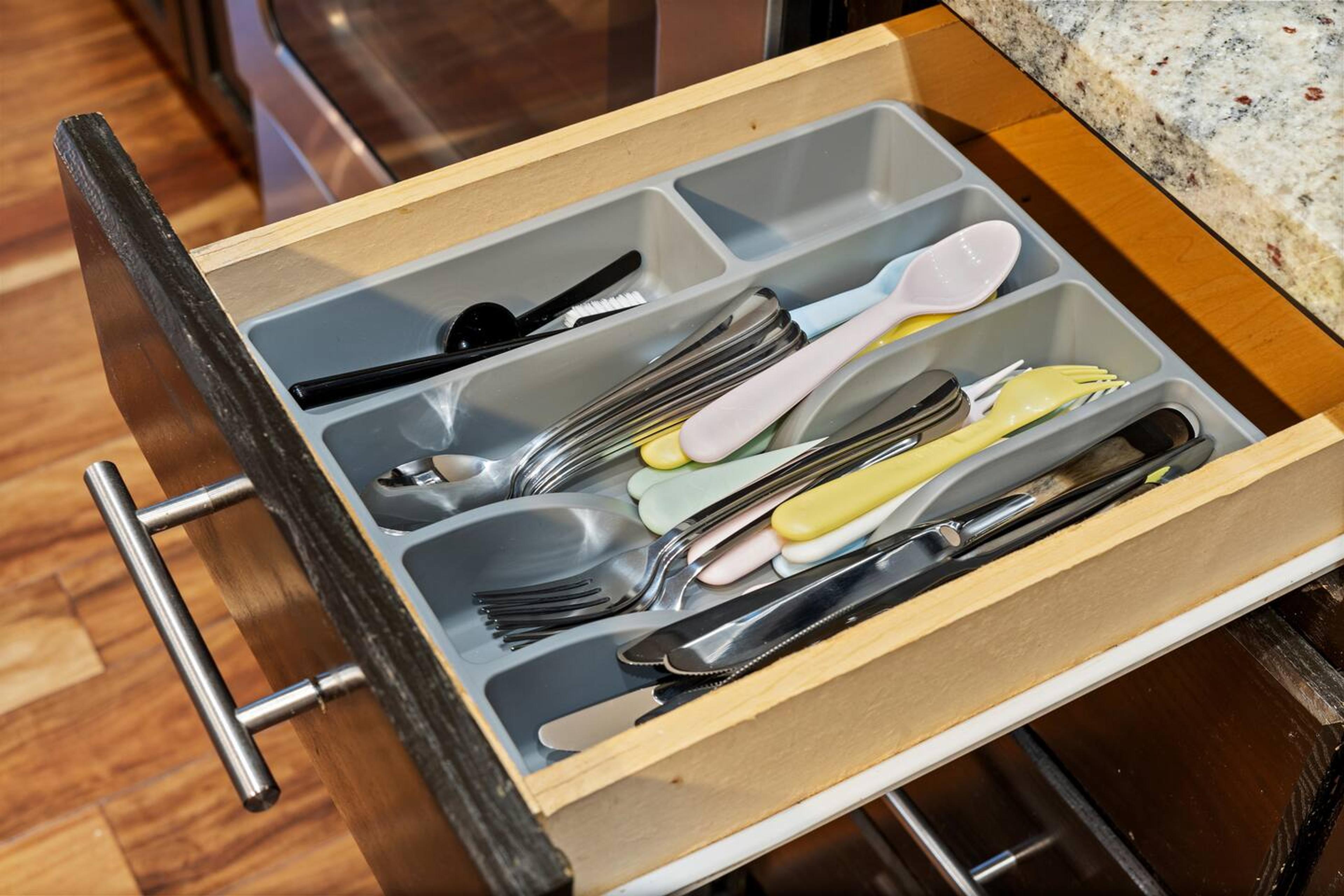 Utensils like spoons, forks, knives for usage in kitchen area