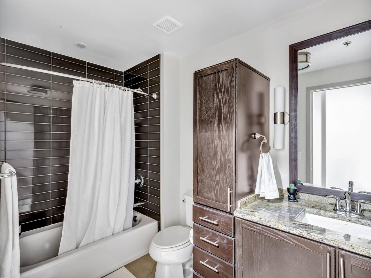 Bathroom : Elevate your daily routine in this immaculate bathroom with thoughtful essentials