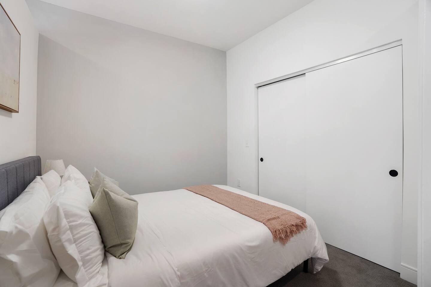 Cozy bedroom with lots of storage space.