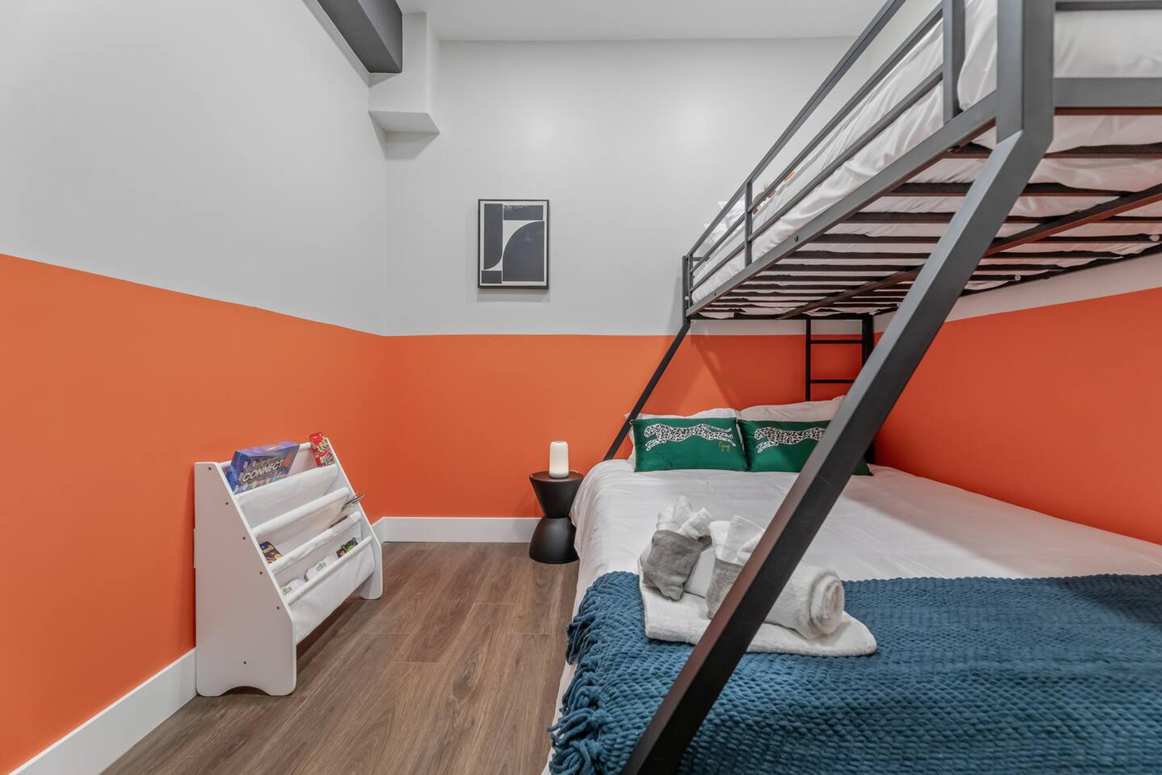 Bedroom 2: Bunk bed with Twin XL over Kind size bed. 
Has: AC, books for kids, games, night light , blanket, pillows and night lamp.