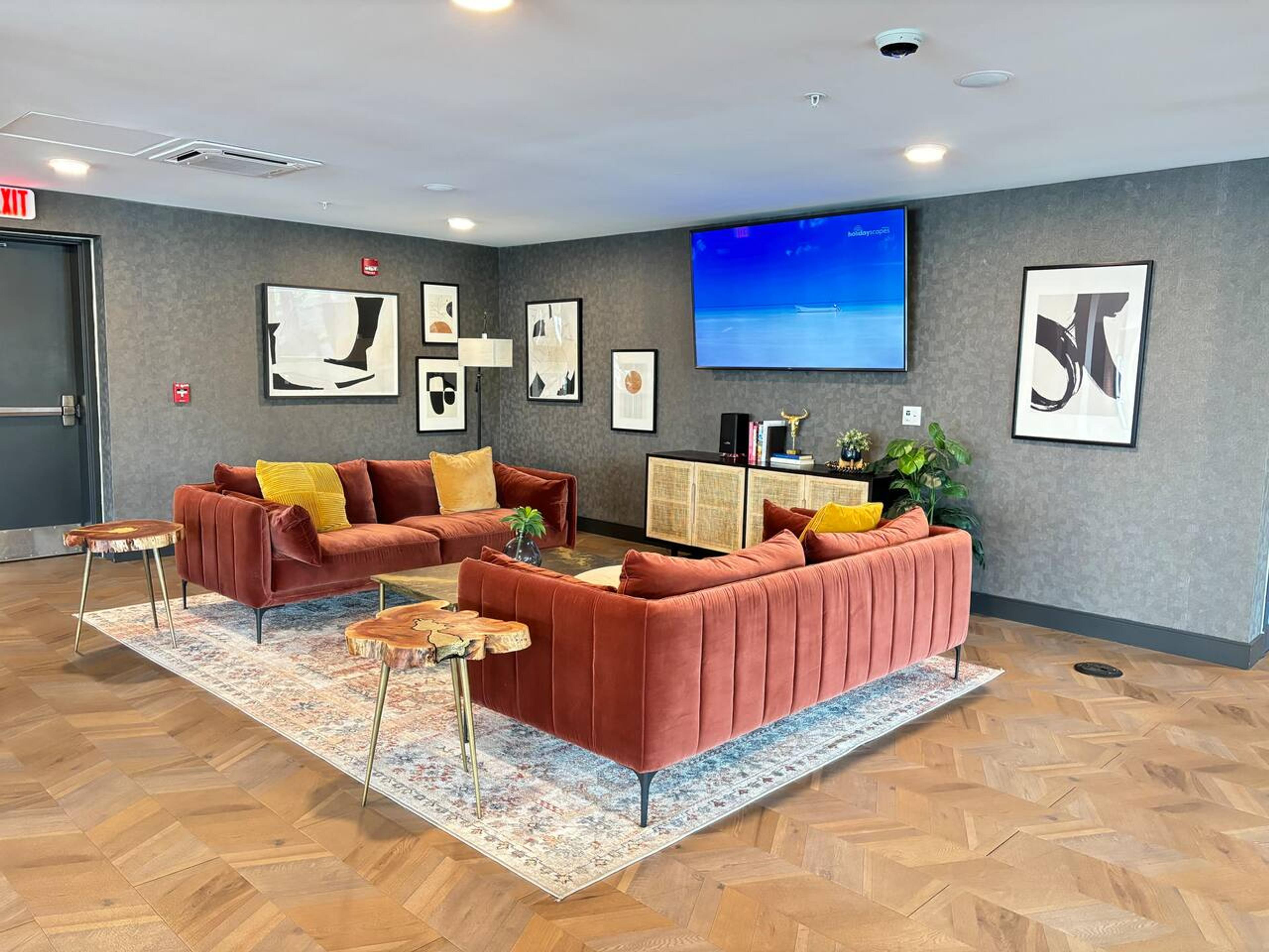 Common area with tv and, couches,  side tablestand books to relax.