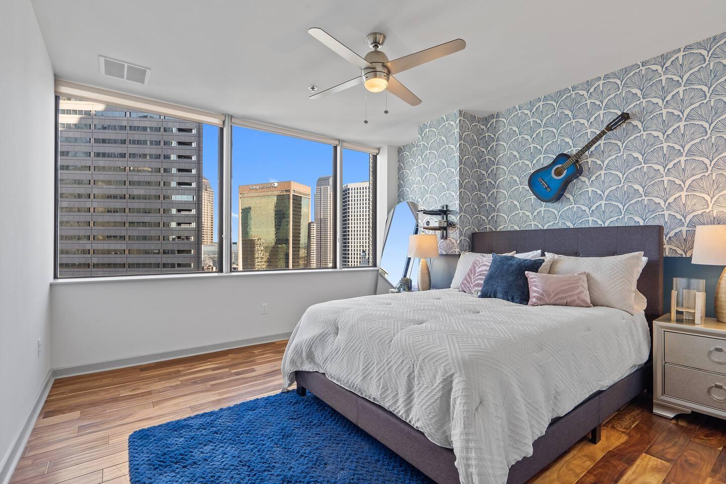 A spacious Queen sized bedroom with complimenting interiors, and a projector for you to enjoy your movie night with your loved ones.
The lamp on left was cracked by one of our little guest but good to use