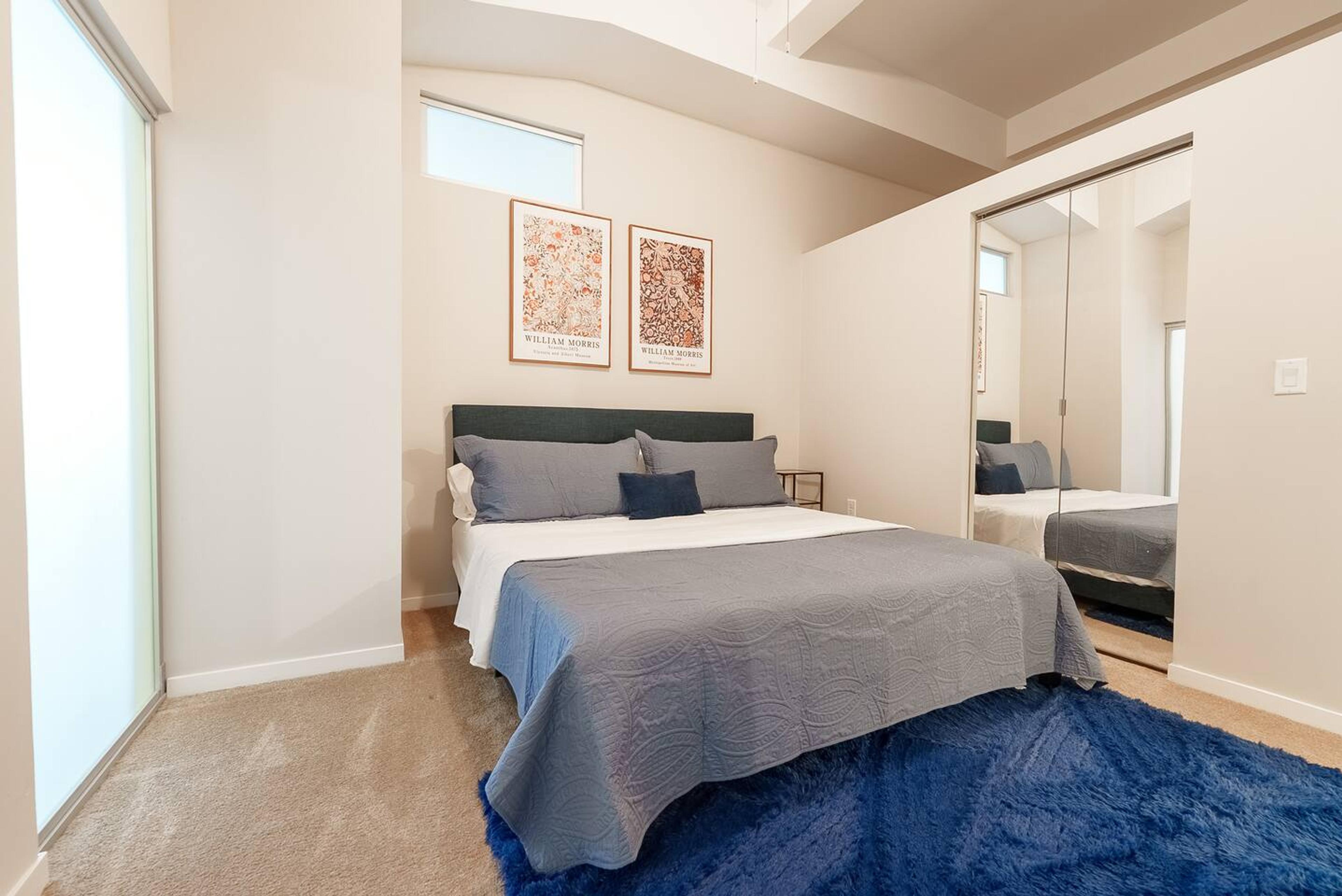 Spacious bedroom featuring a comfortable king-size bed.