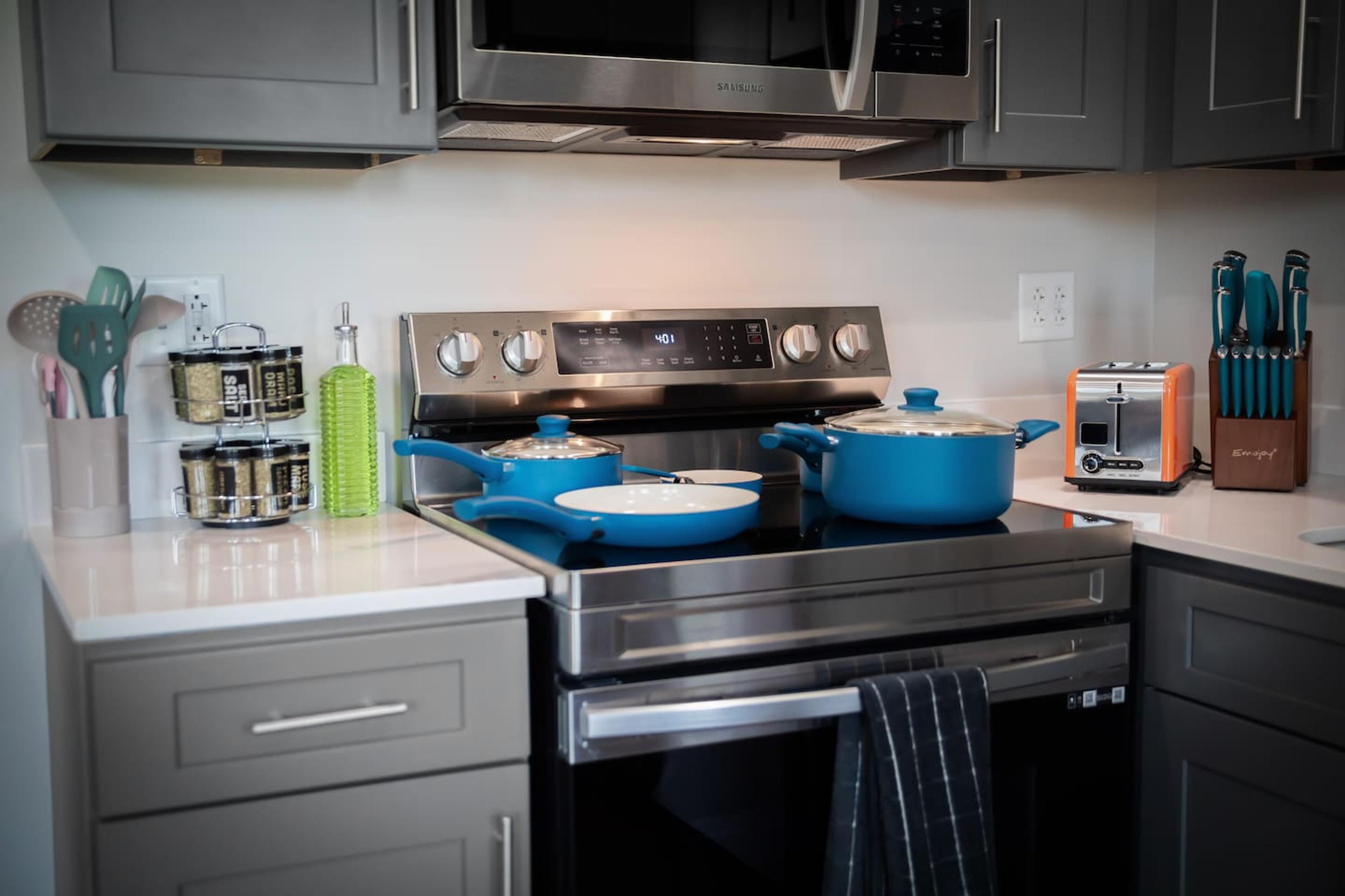 Kitchen: Electric stove, pots and pans, oil ,spice rach , bagel / bread toaster, knife set