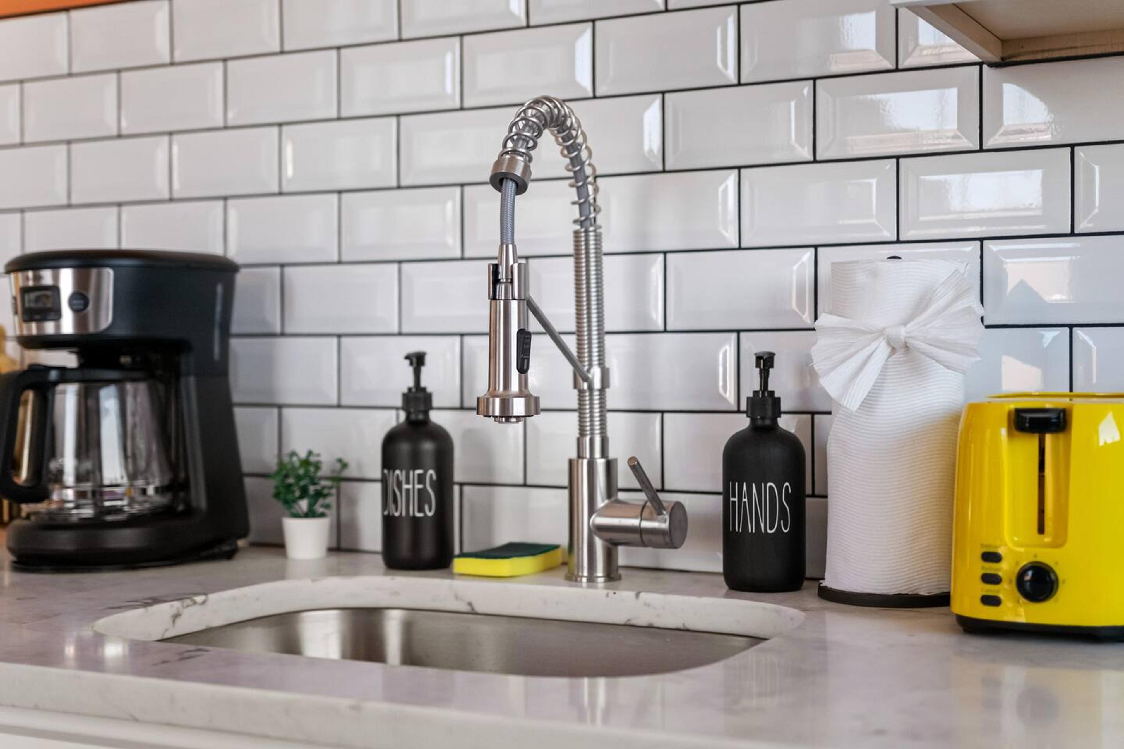 Kitchen sink with liquid soaps for your hands and dishes