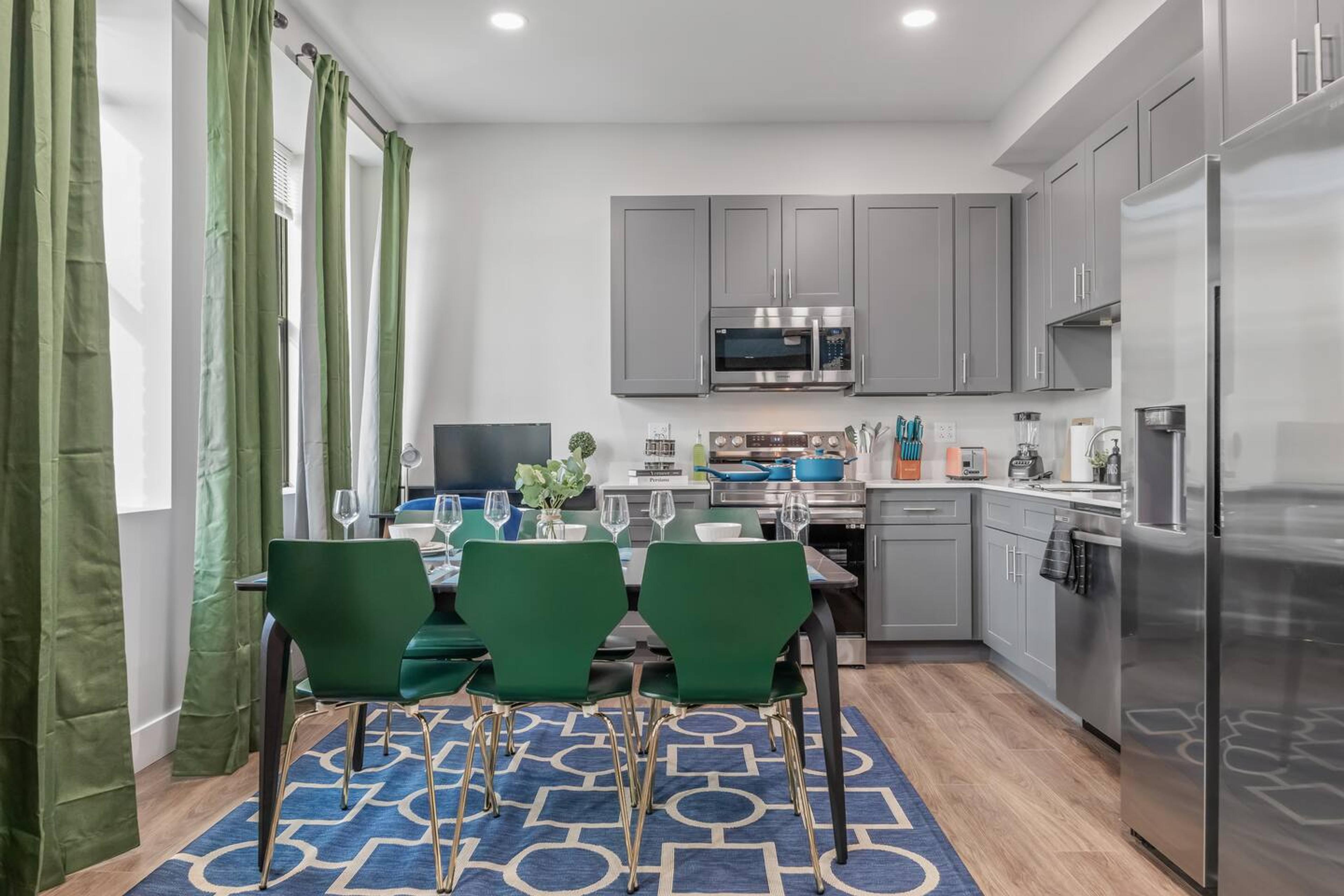 This dining room is perfect for entertaining. It has a large table that can seat six people comfortably.