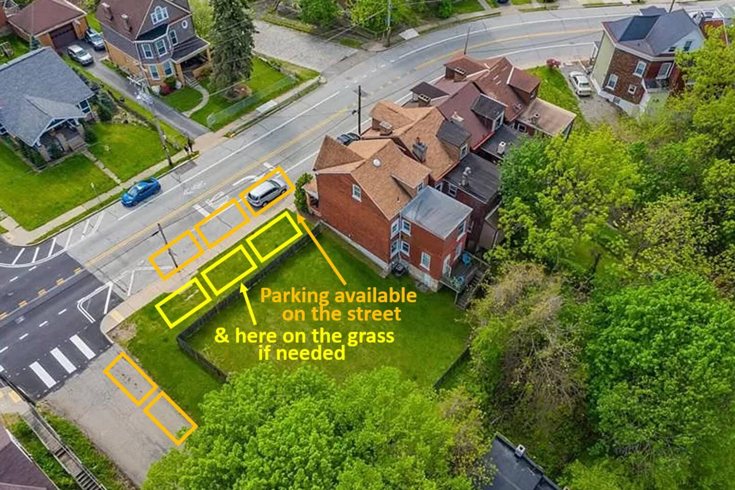 Aerial view showing the parking area around the property.