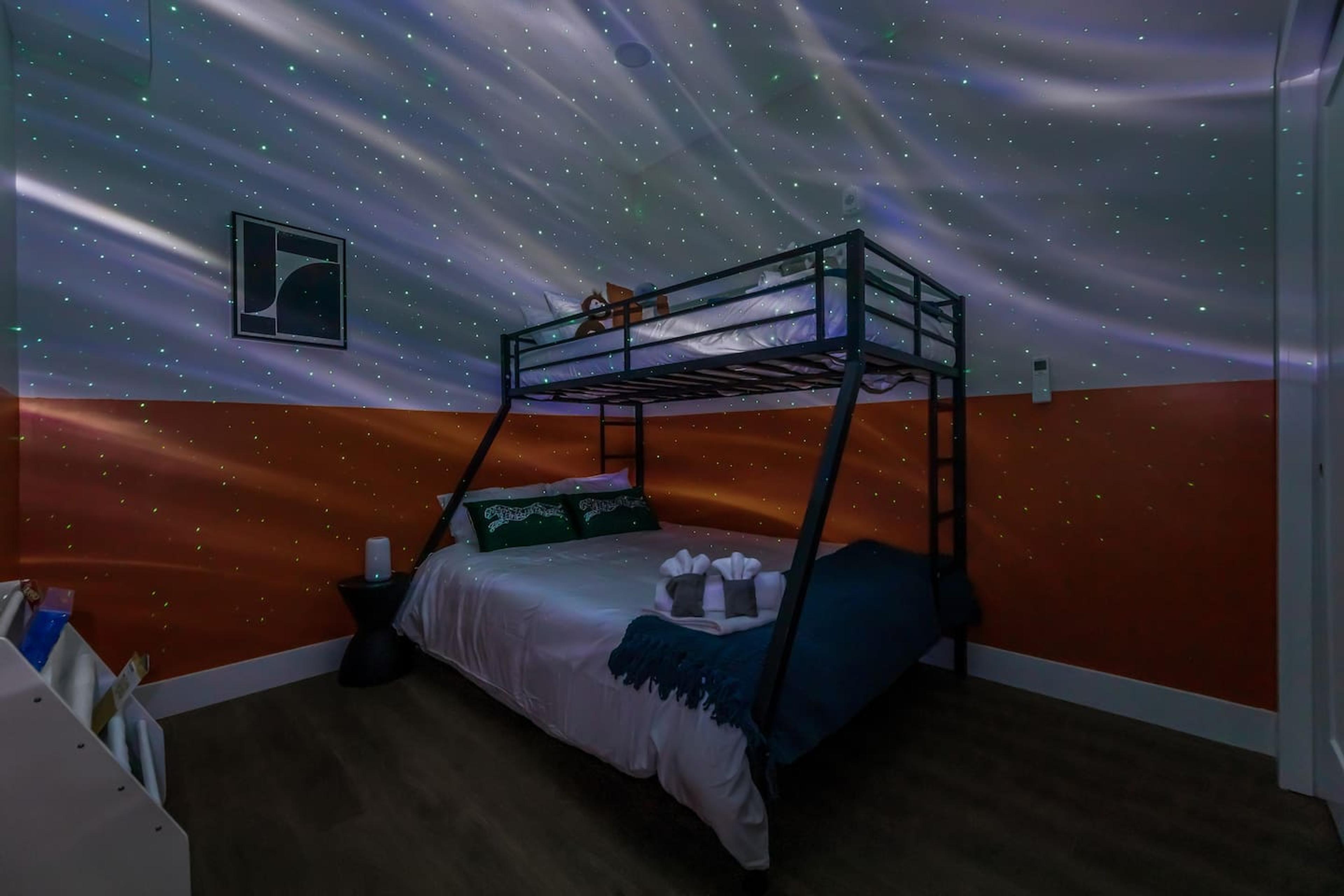 Bedroom 2: Bunk bed with Twin XL over Kind size bed. 
Has: AC, books for kids, games, night light , blanket, pillows and night lamp.