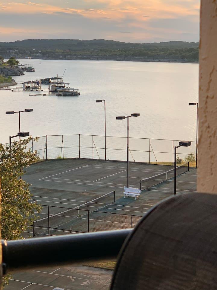 Tennis court with lake view