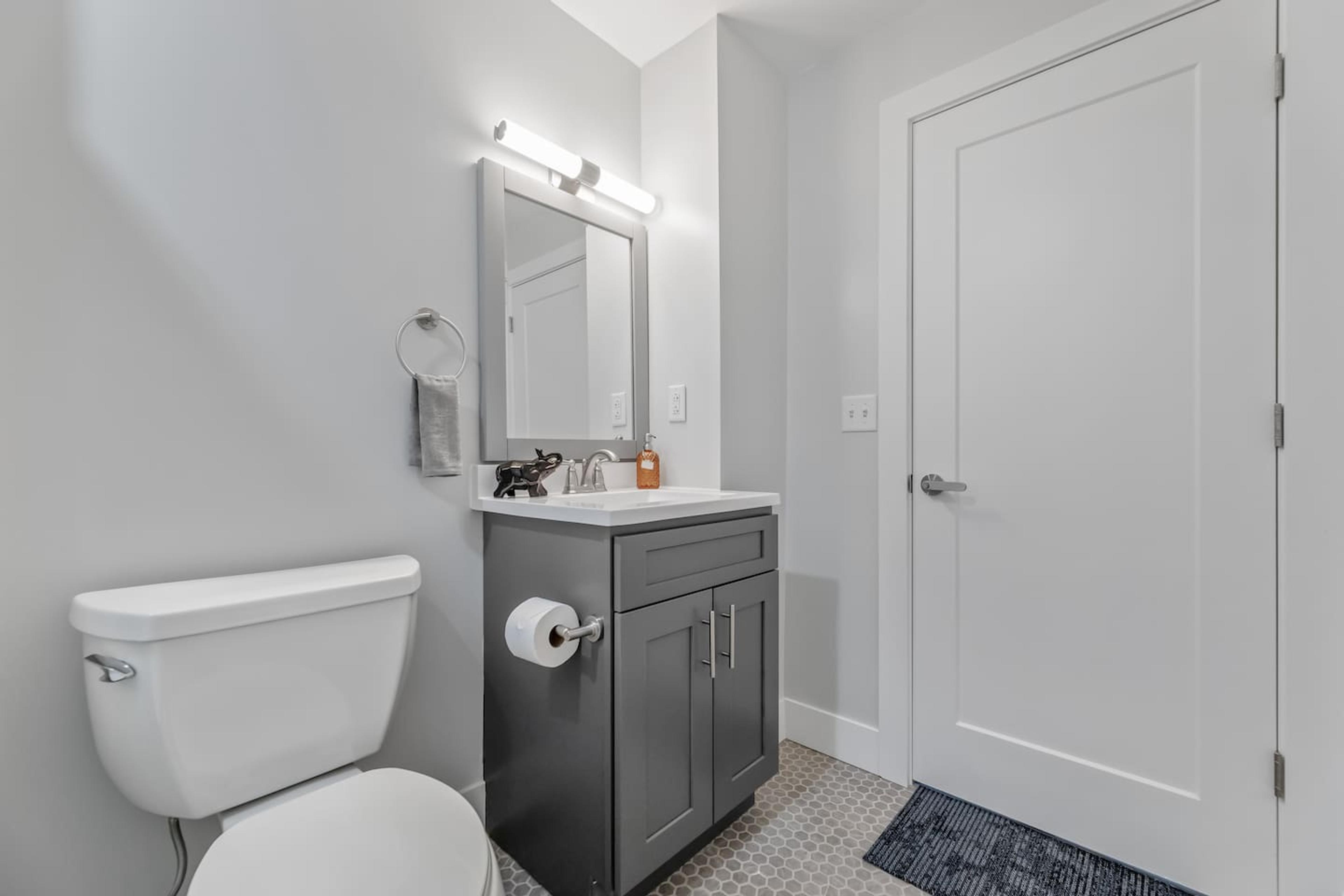 The bathroom area is spacious and has all the amenities you need, including a toilet, sink, and shower. It's a great place to relax and unwind after a long day of sightseeing.