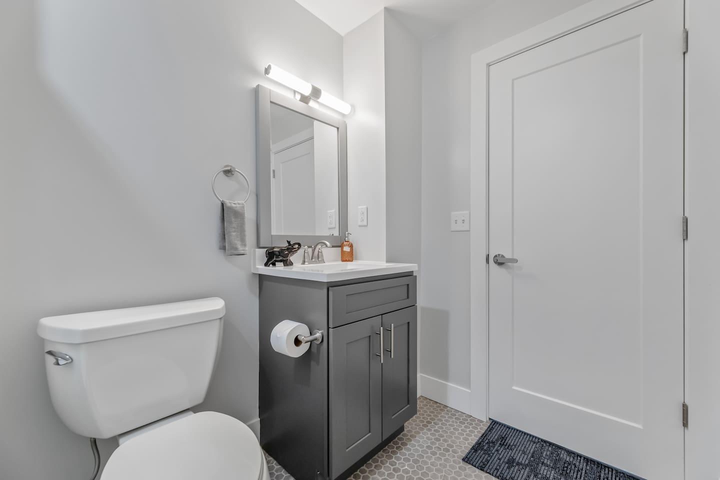 The bathroom area is spacious and has all the amenities you need, including a toilet, sink, and shower. It's a great place to relax and unwind after a long day of sightseeing.