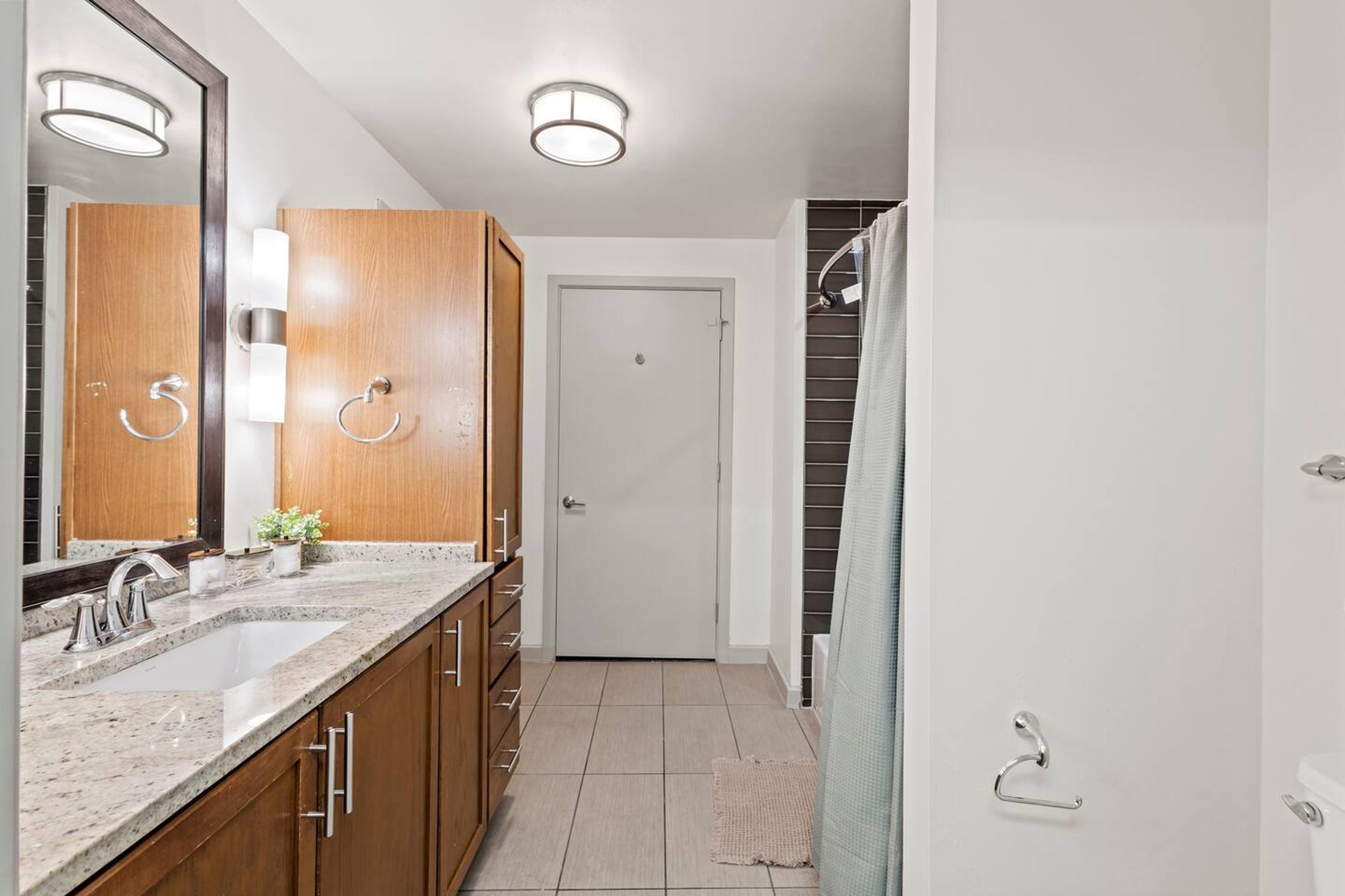 Bathroom : Elevate your daily routine in this immaculate bathroom with thoughtful essentials