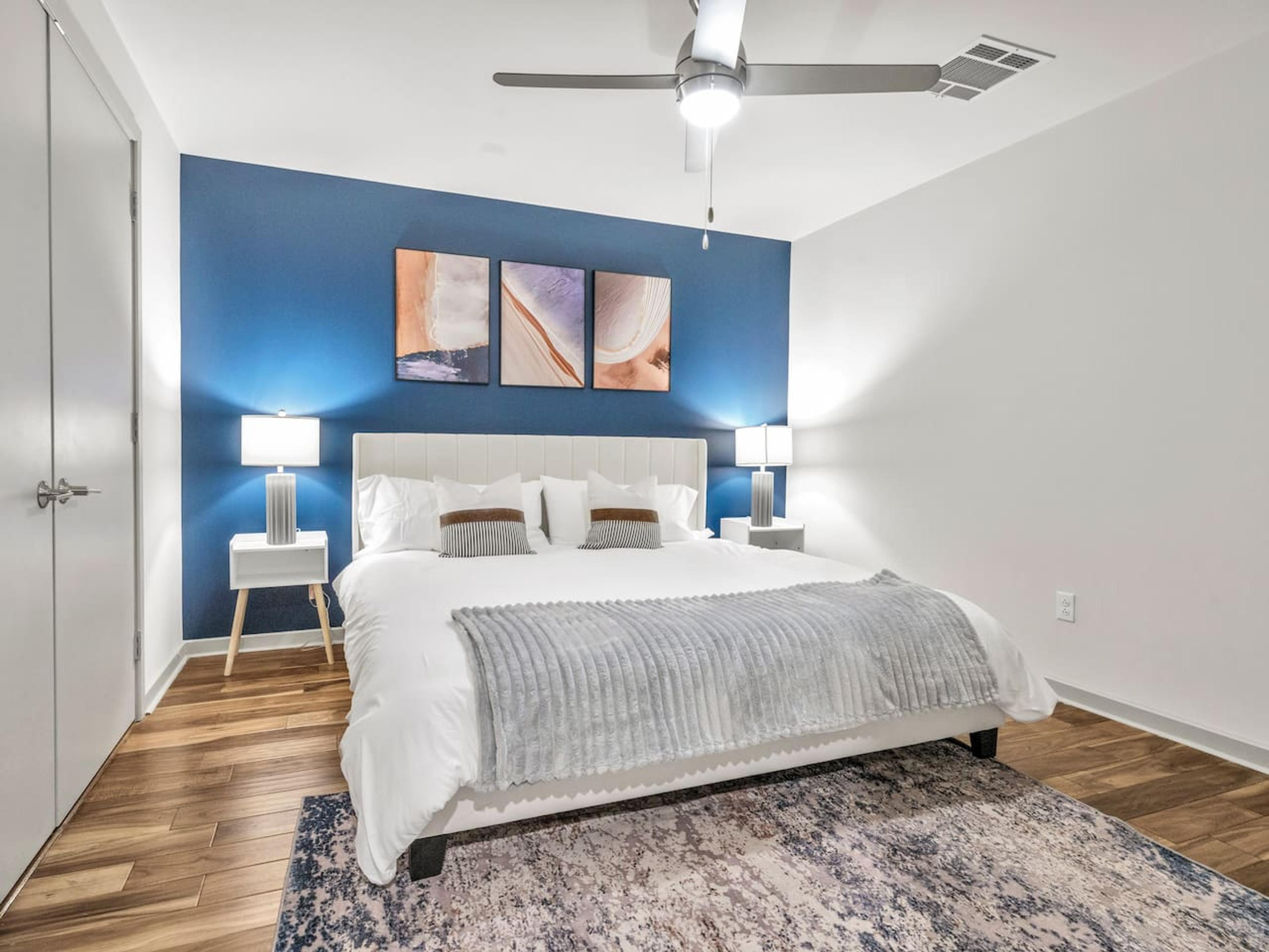 A Perfect cute spacious bedroom with one king bed that sleeps 2 adults. Designed with with comfort in mind and equipped with memory foam mattress, Cozy bedroom with nightstands, Pack N Play