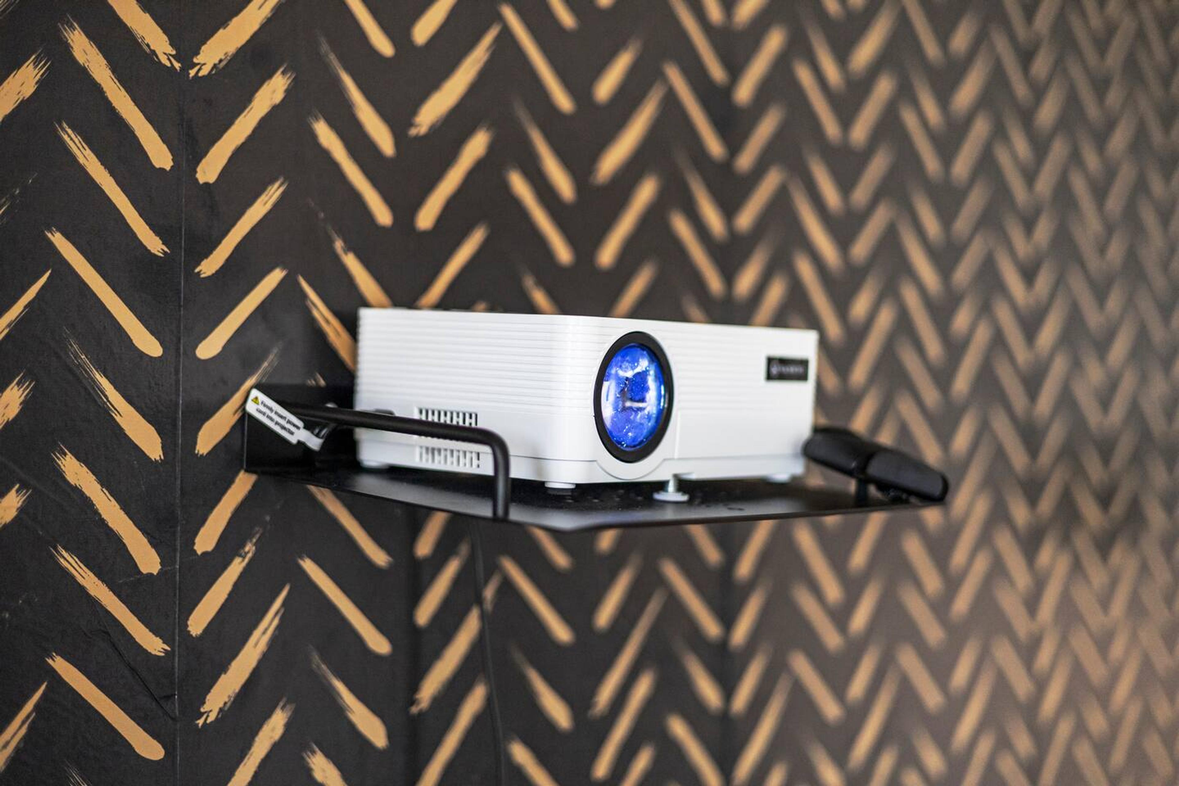Cozy Movie Nights:  your own private projector setup for the ultimate stay! ️