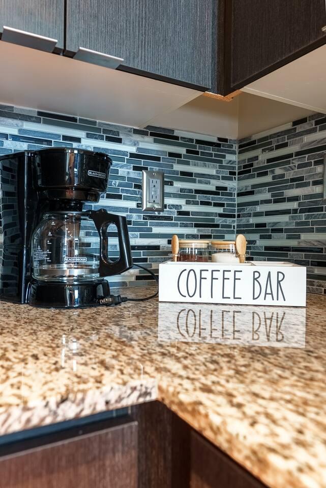 Enjoy our coffee bar — perfect for your morning brew or an afternoon pick-me-up.
