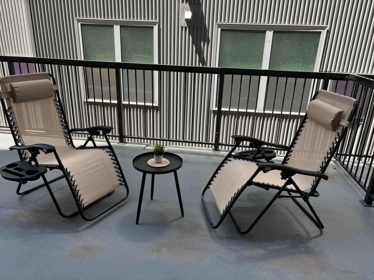 This is a picture of the balcony. It's a great place to sit and relax. There's a table and chairs, and it's a nice place to enjoy a cup of coffee or tea.