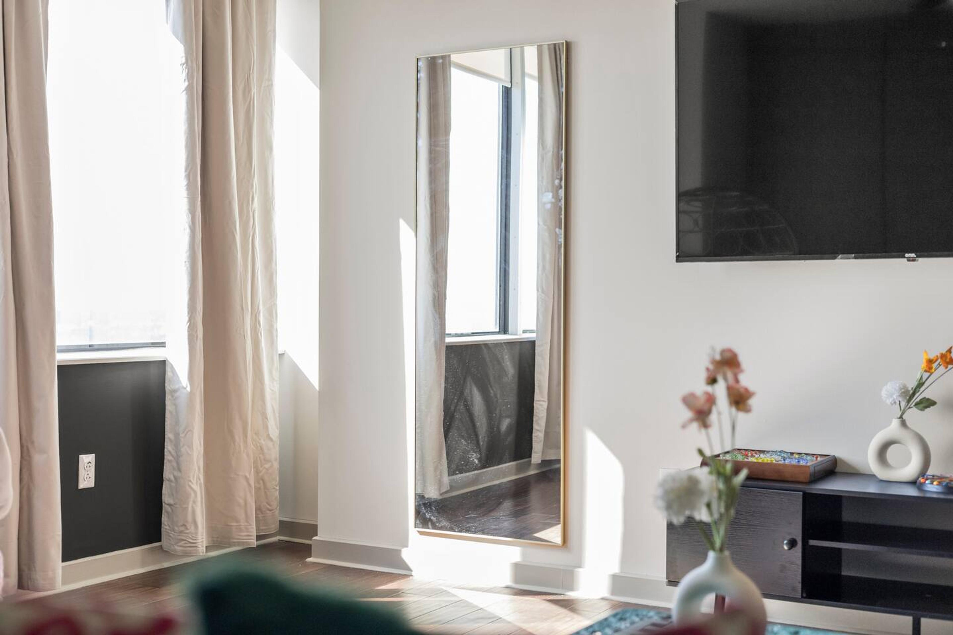 A small mirror in the living room.
