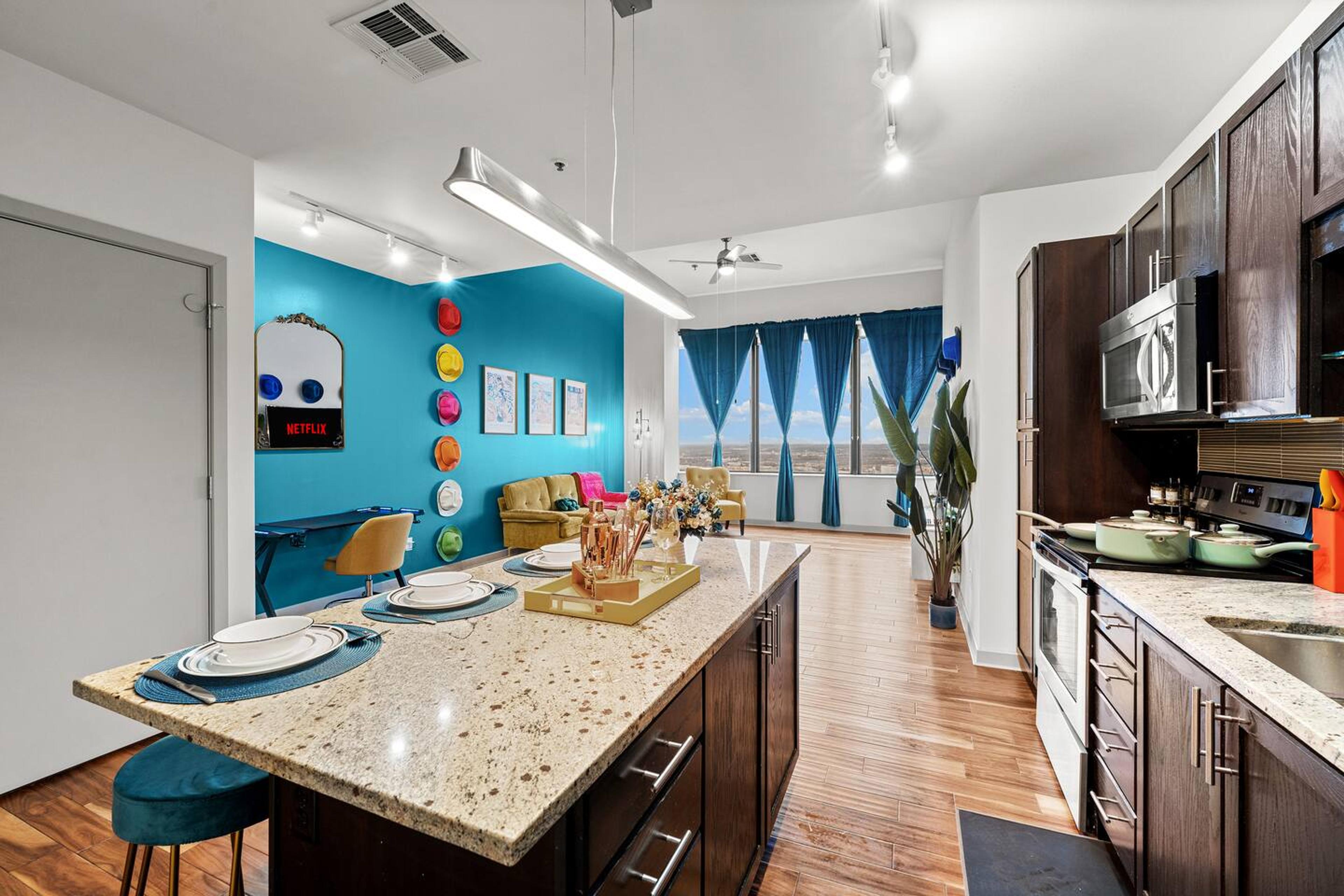 Kitchen with stainless steel appliance. Equipped with utensils and basic needs for short and mid term stay.