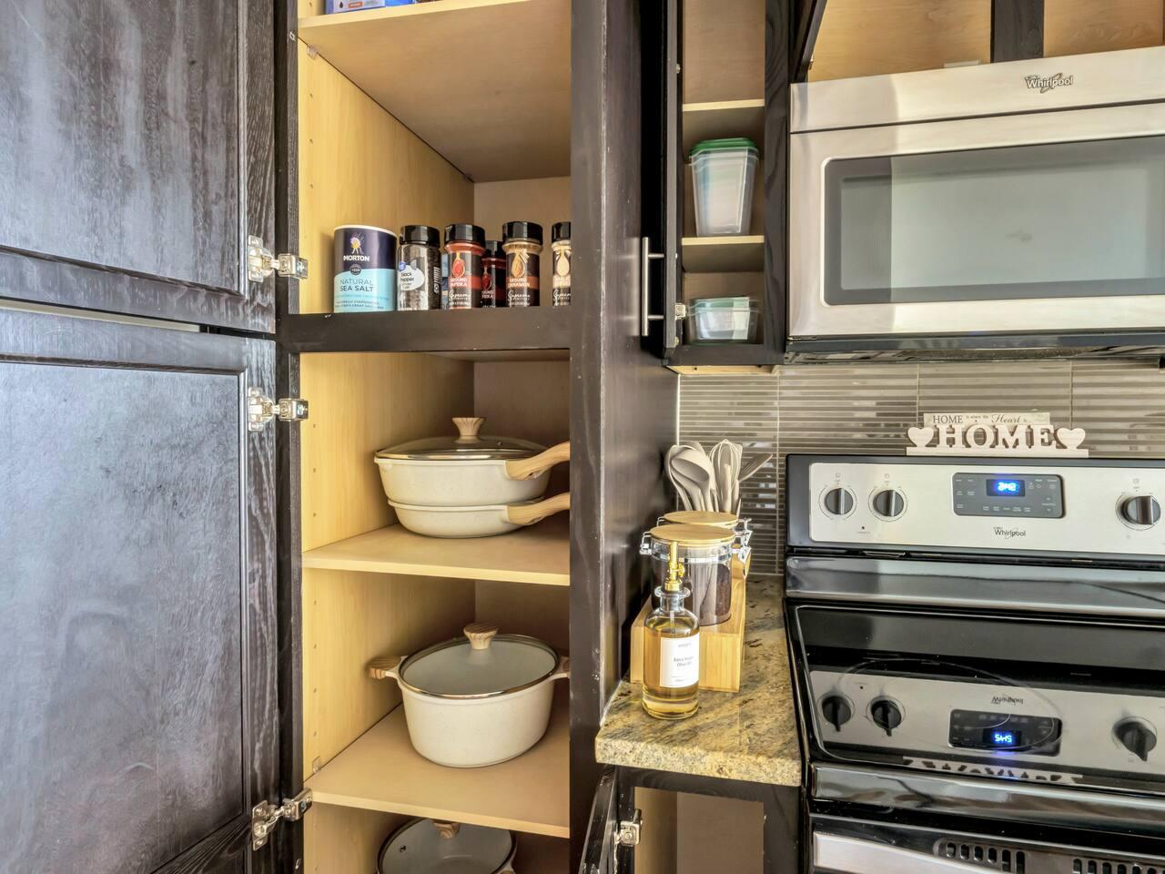 Fully equipped Kitchen: Kettle, knife set, coffee maker, cutting board, blender, electric stove, microwave, oven, spatulas, whiskers, toaster, stainless steel appliances ,pots, pans, spice cabinet.