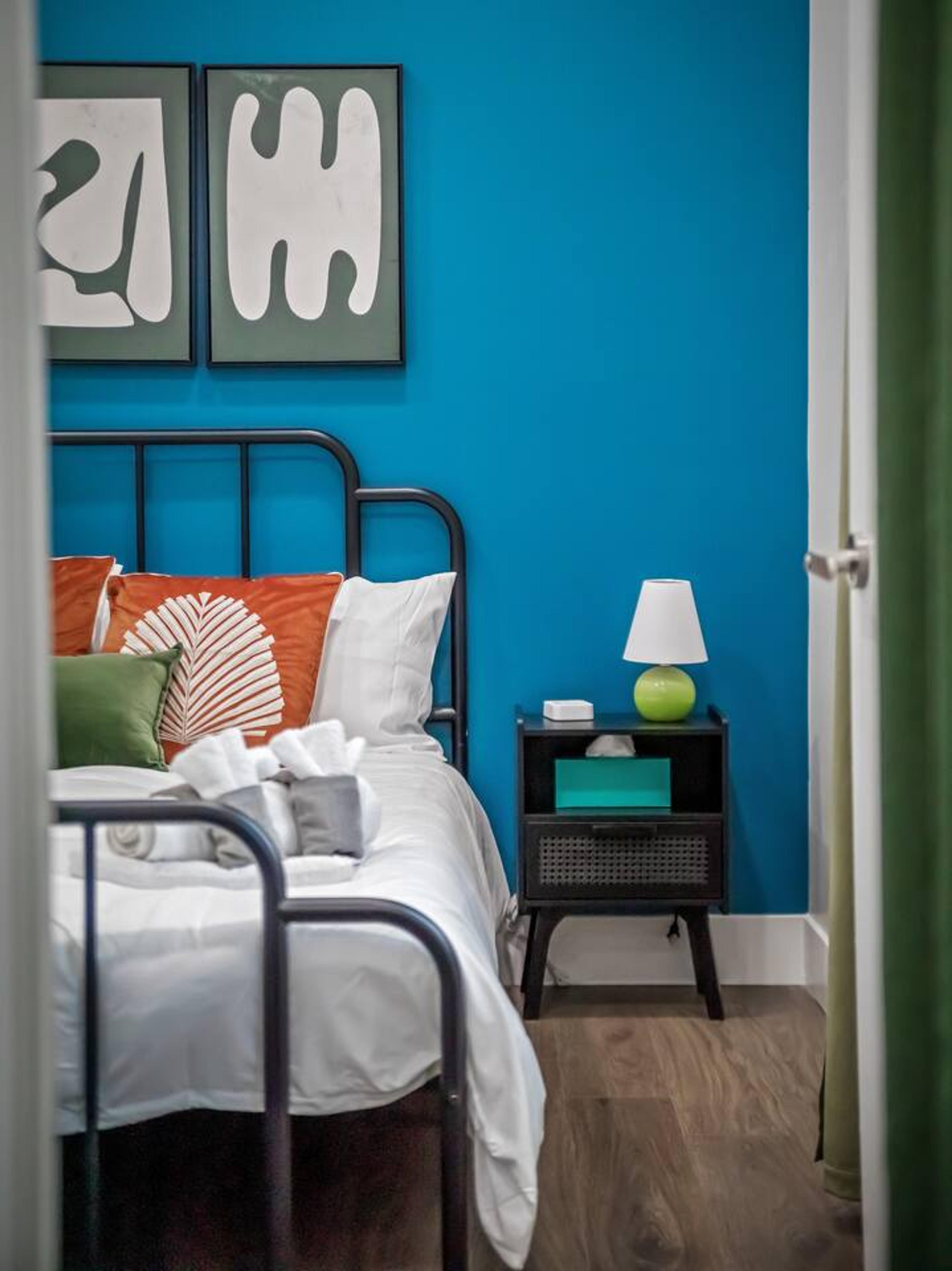 Bedroom 1 : Queen size bed with comfy mattress and two side table with night lamps and charging station on each.