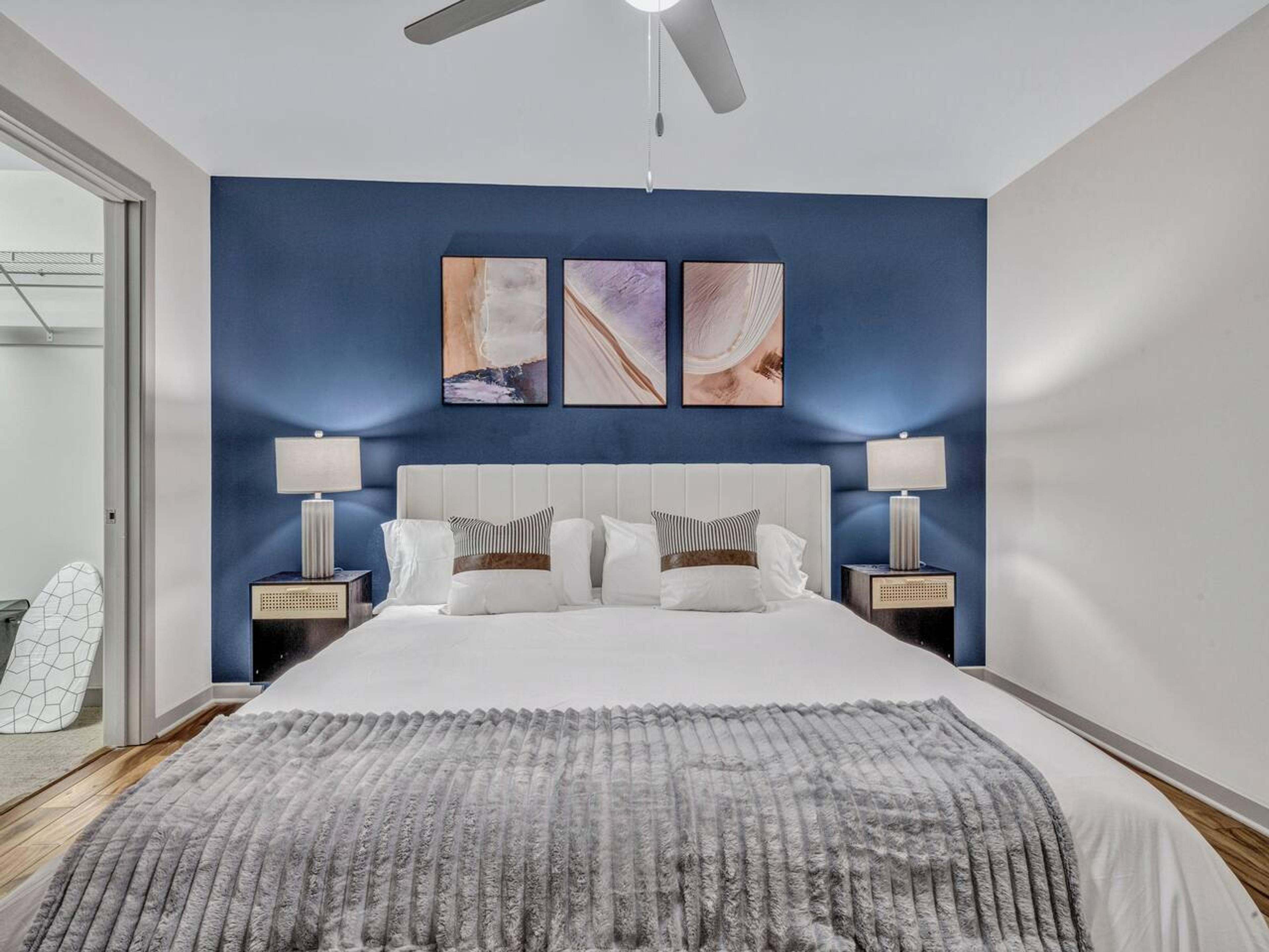 A Perfect cute spacious bedroom with one king bed that sleeps 2 adults. Designed with with comfort in mind and equipped with memory foam mattress, Cozy bedroom with nightstands, Pack N Play