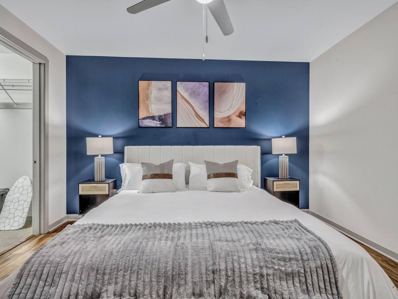 A Perfect cute spacious bedroom with one king bed that sleeps 2 adults. Designed with with comfort in mind and equipped with memory foam mattress, Cozy bedroom with nightstands, Pack N Play