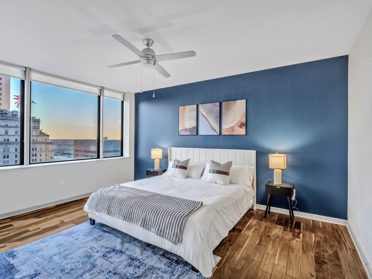 A Perfect cute spacious bedroom with one king bed that sleeps 2 adults. Designed with with comfort in mind and equipped with memory foam mattress, Cozy bedroom with nightstands, Pack N Play