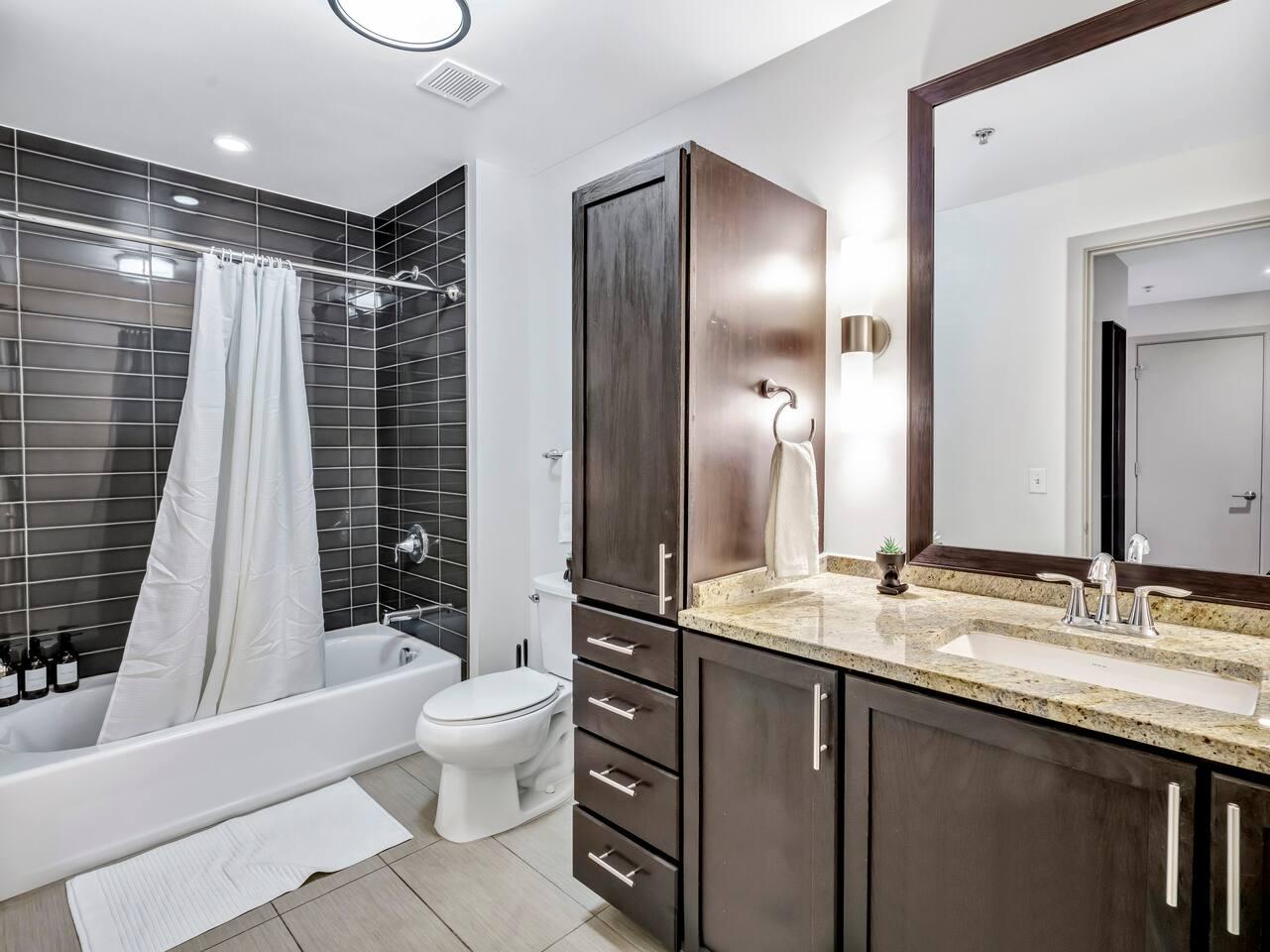 Bathroom : Elevate your daily routine in this immaculate bathroom with thoughtful essentials