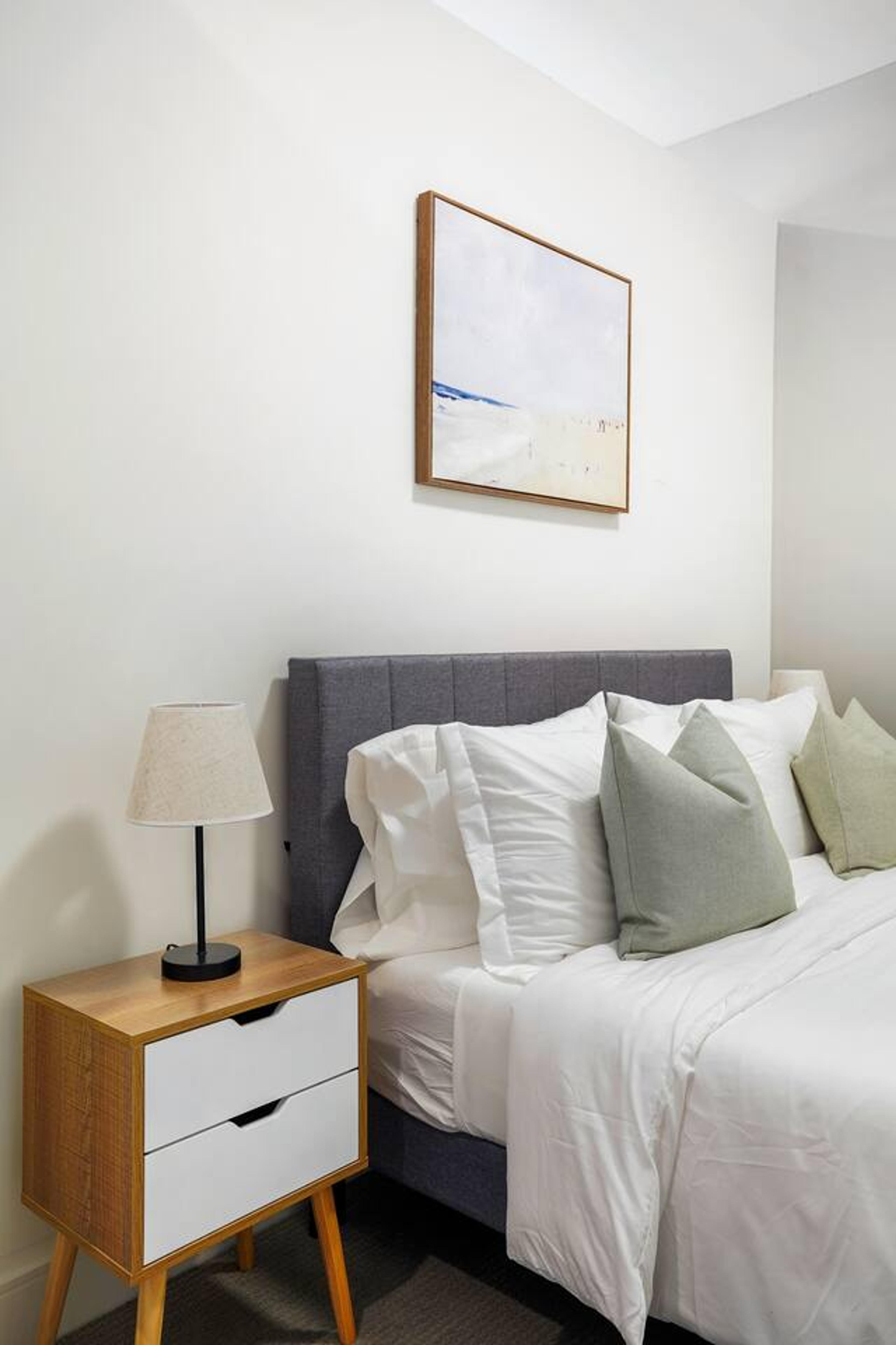 Bedroom photo w/ cabinet on the side