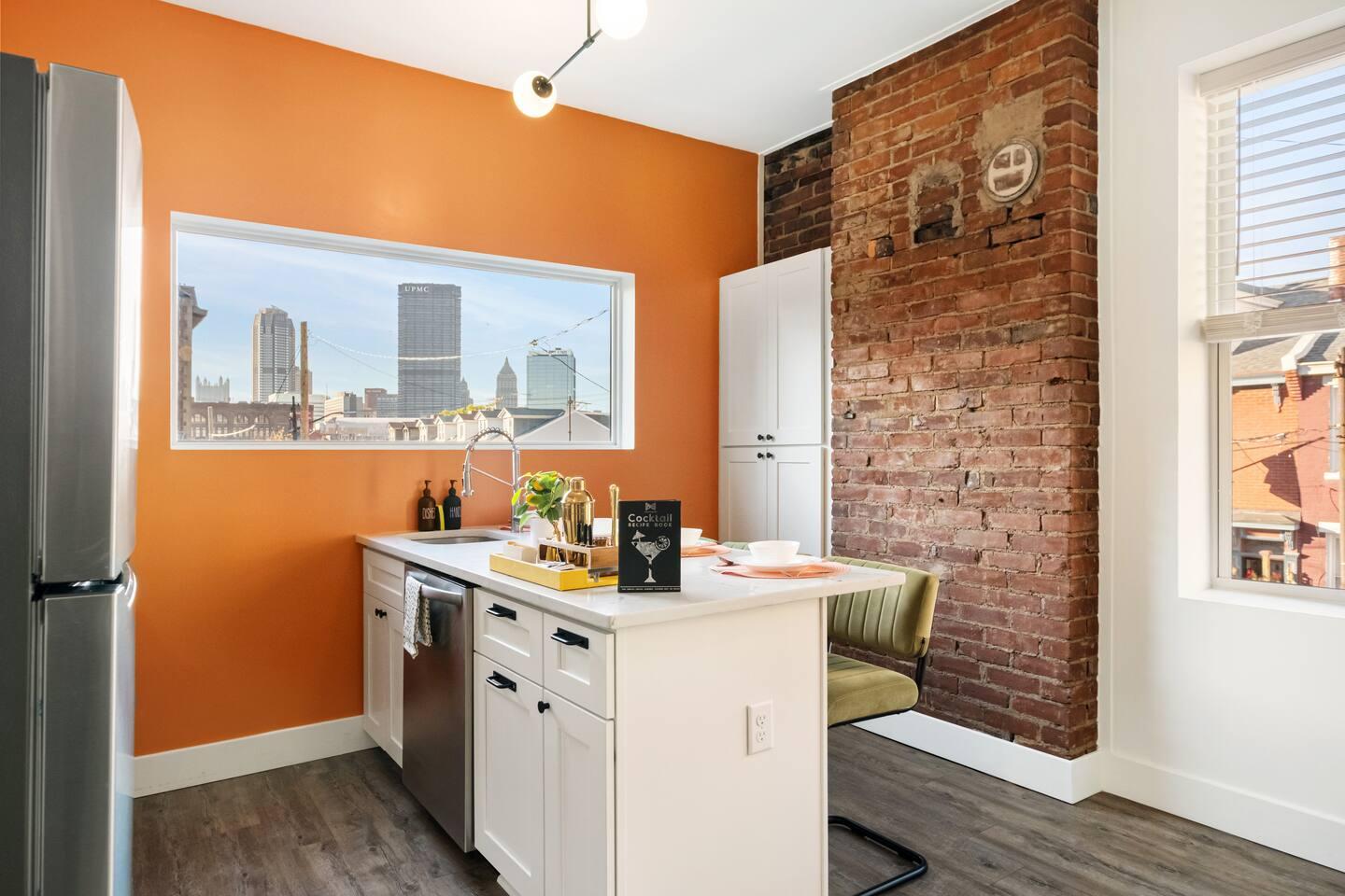 Enjoy cooking in our fully equipped kitchen with stunning city views. ✨