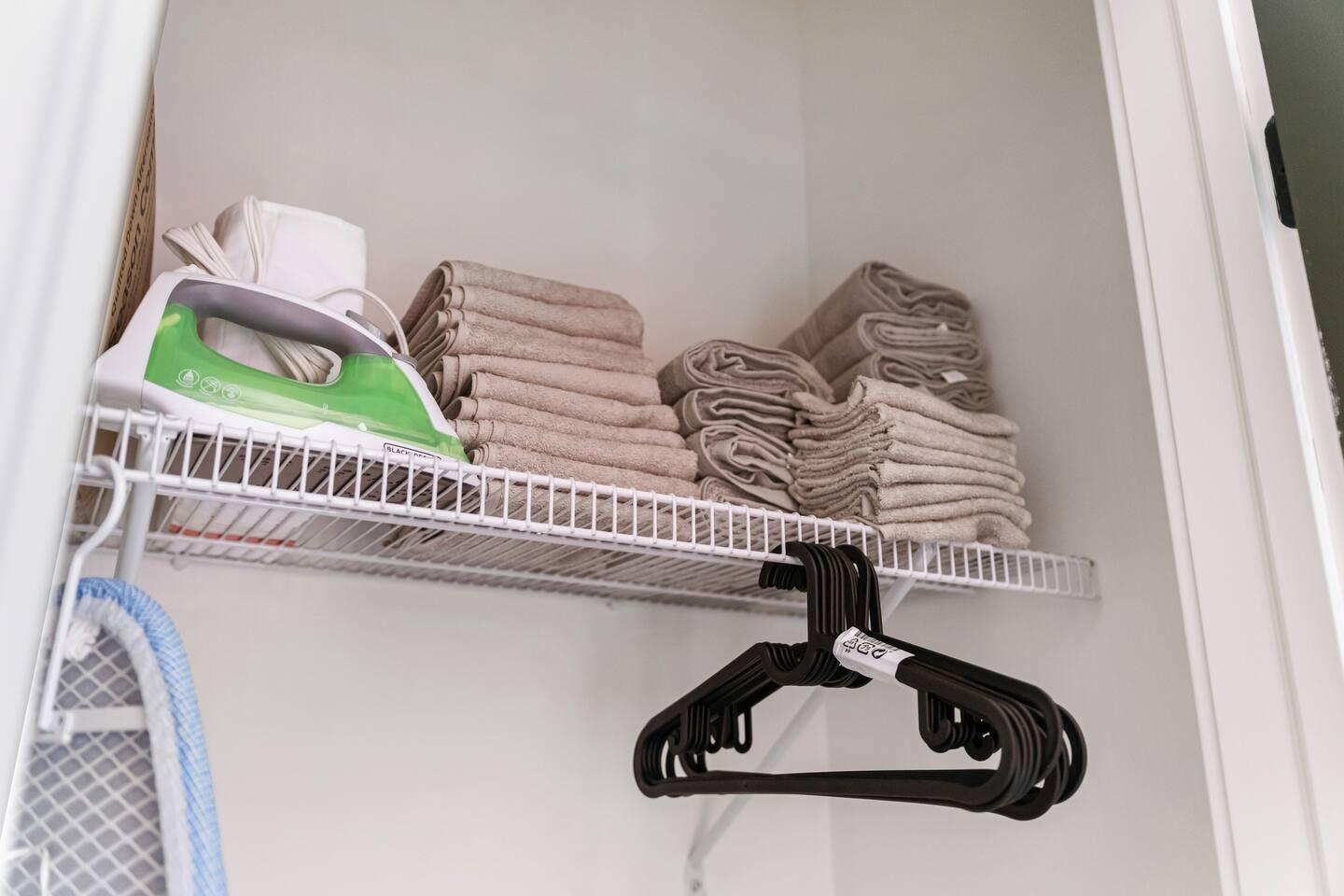 Our closet space with iron , ironing table ,extra towels, and hangers for your clothes.