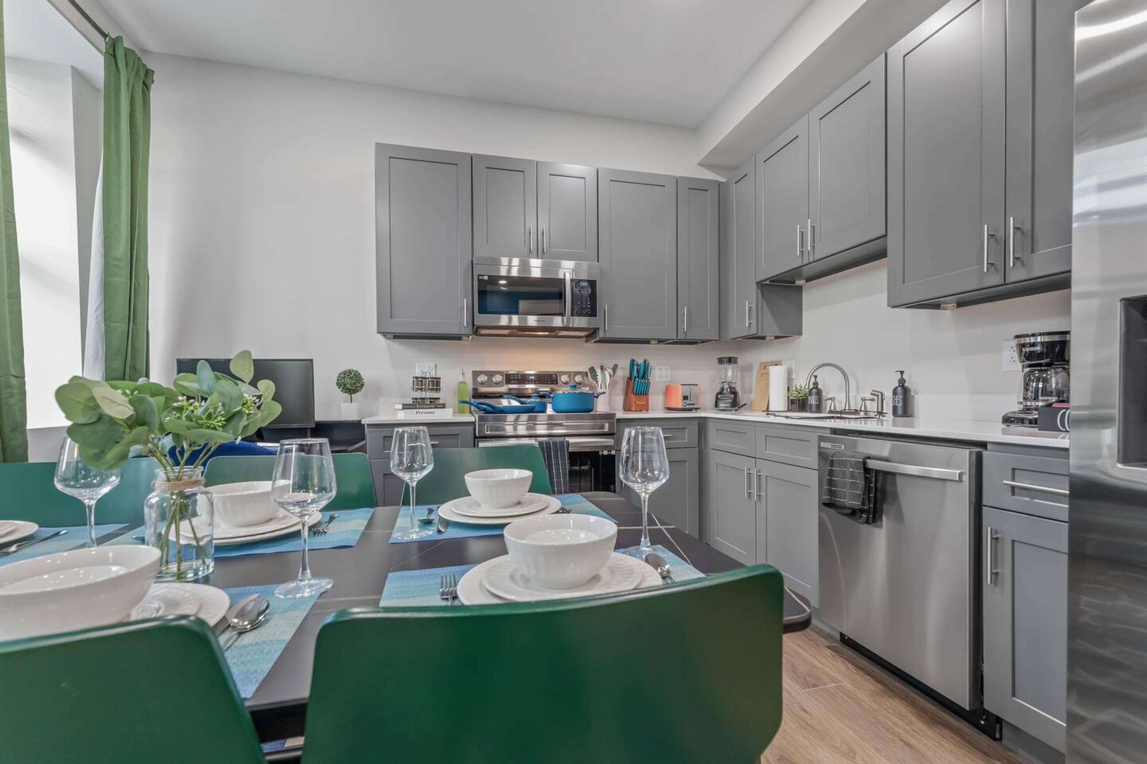 Classic dining room provided with amenities like different cooking cutlery sets, dining plates, glassware and etc. We also have an microwave and an oven for your use