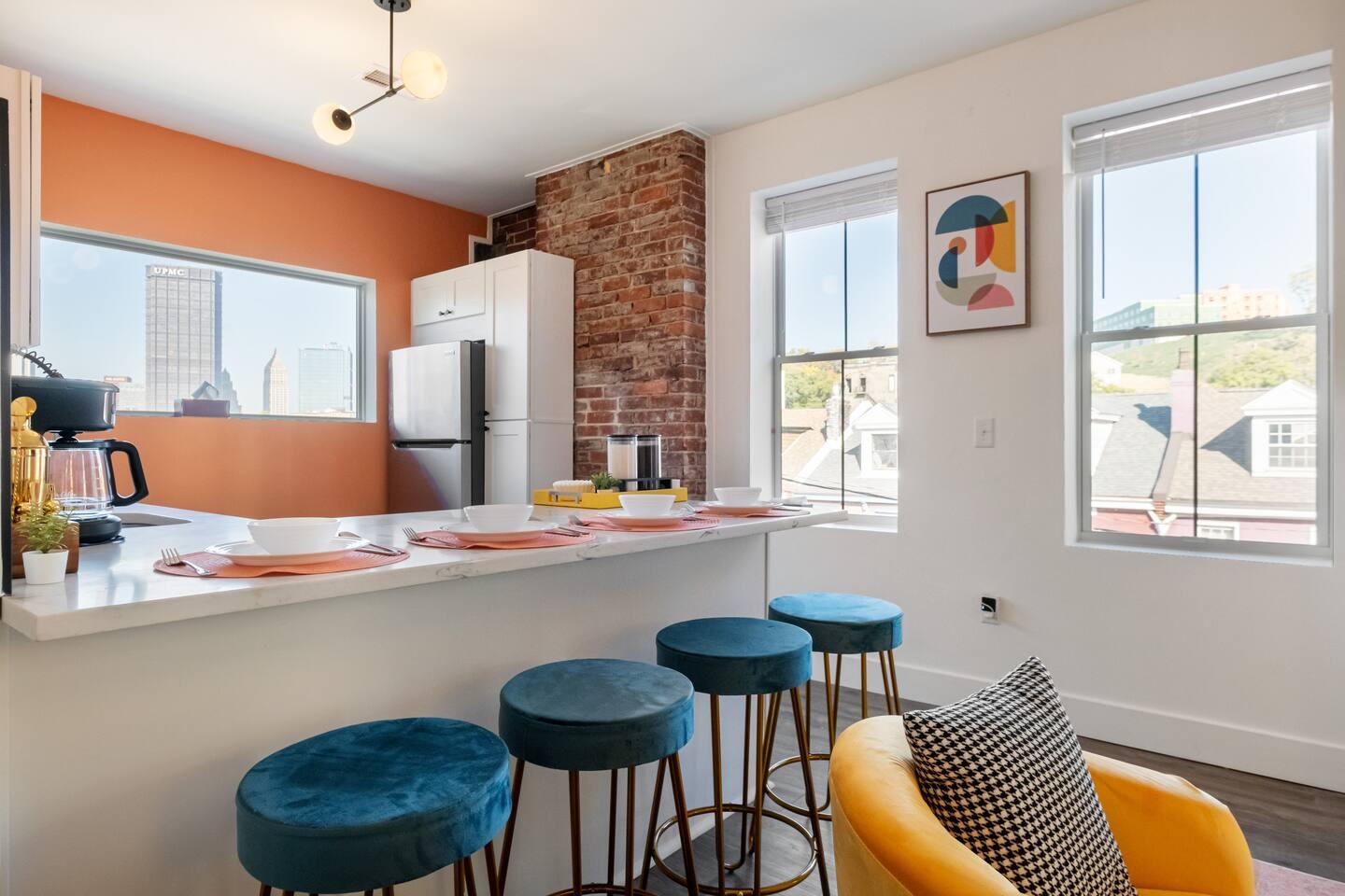 This dining room is perfect for entertaining. It has a large table that can seat 4 people comfortably with an attached sink. Also a cocktail mixer to find your hidden bartender skills!