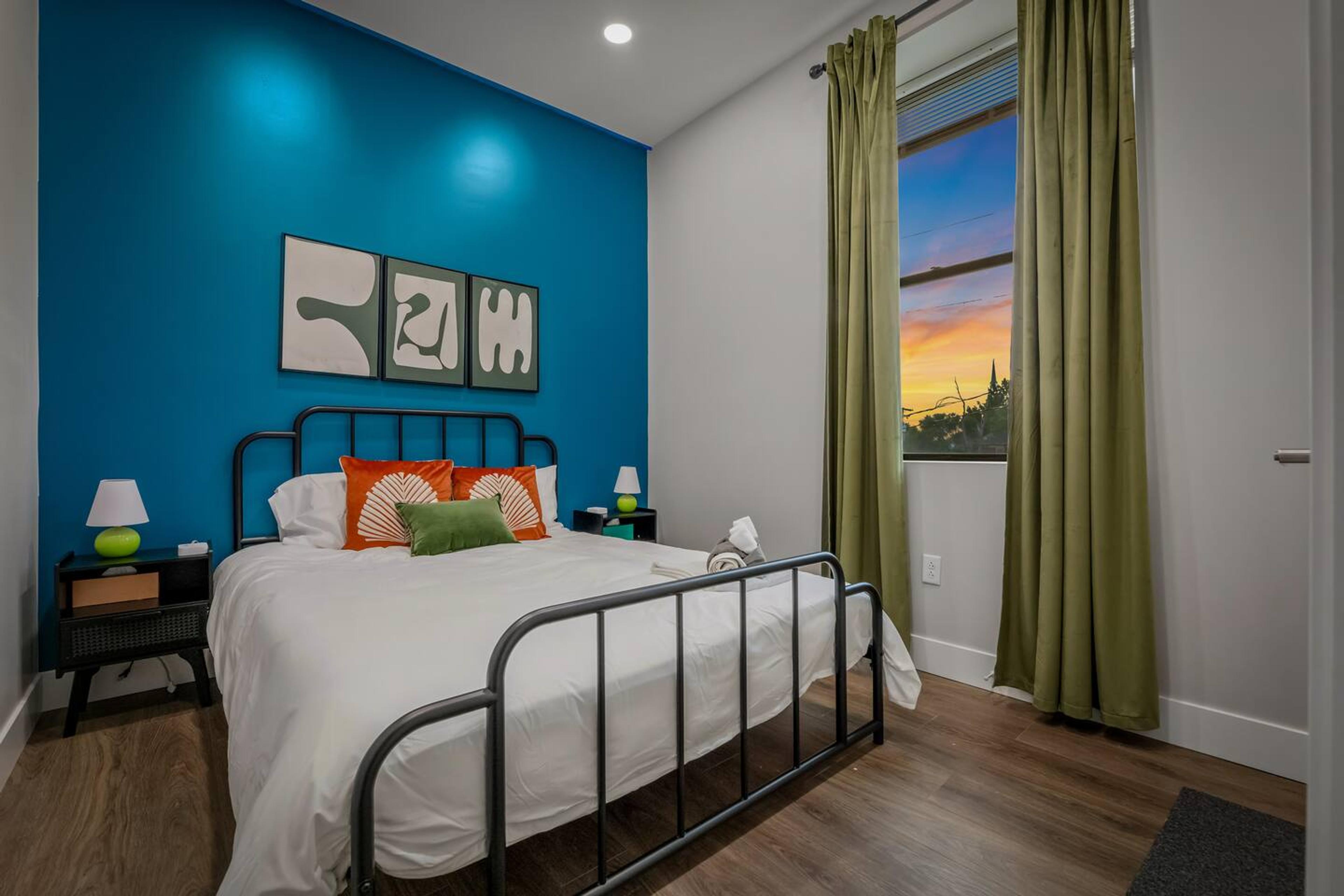 Bedroom 1 : Queen size bed with comfy mattress and two side table with night lamps and charging station on each.