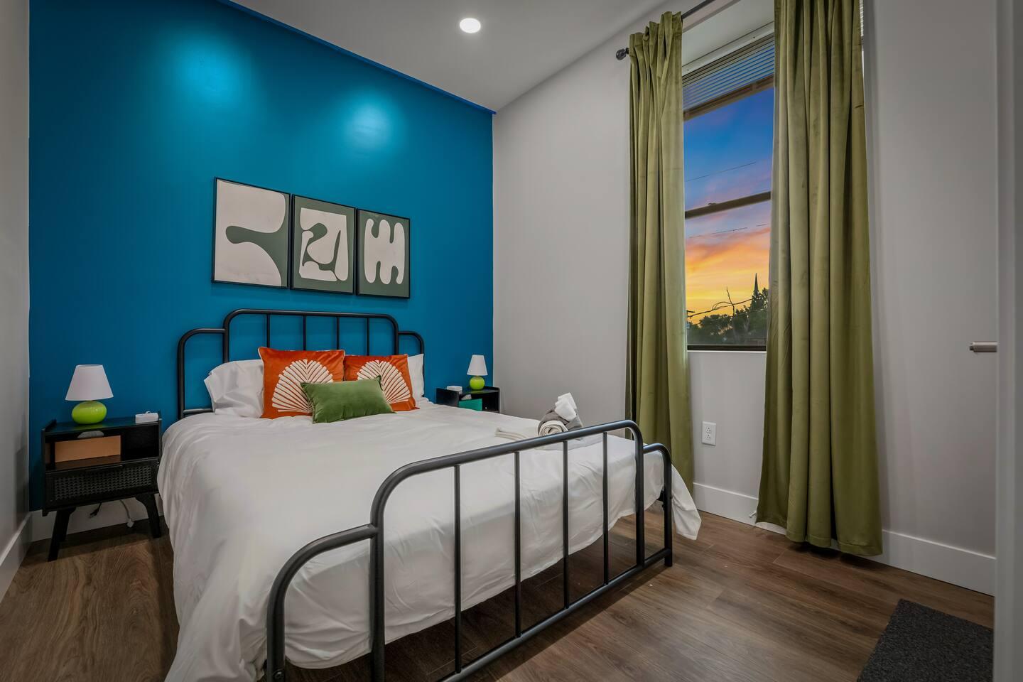 Bedroom 1 : Queen size bed with comfy mattress and two side table with night lamps and charging station on each.