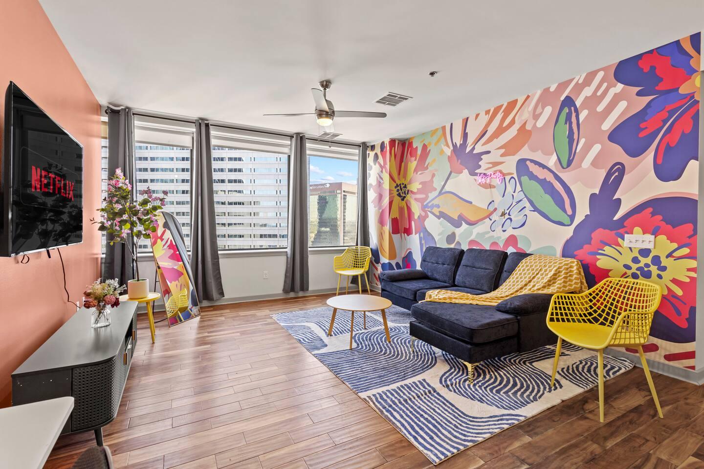 Bright & Colorful Living Room: Relax on the comfy couch and enjoy your favorite shows on the 65" TV ️✨