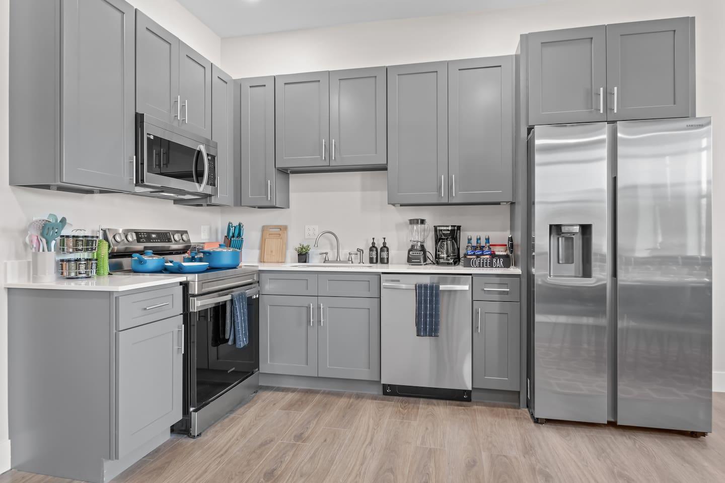 Full kitchen : with Pots, olive oil, spice rack , sugar, salt , pepper , knife set , cutlers, spoons, cutting board etc.,