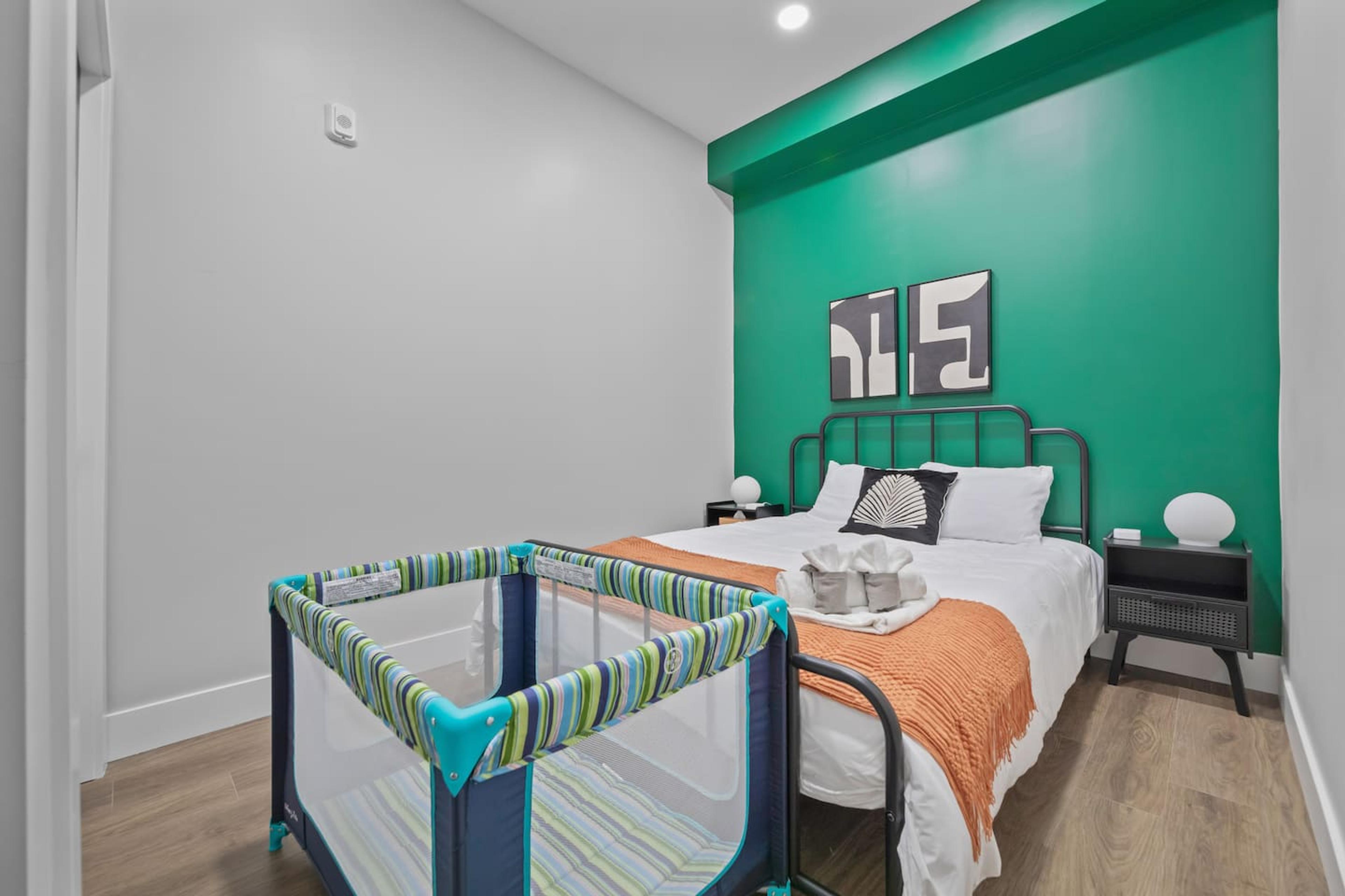 This bedroom is furnished with a crib, which makes it ideal for a family with a young child.