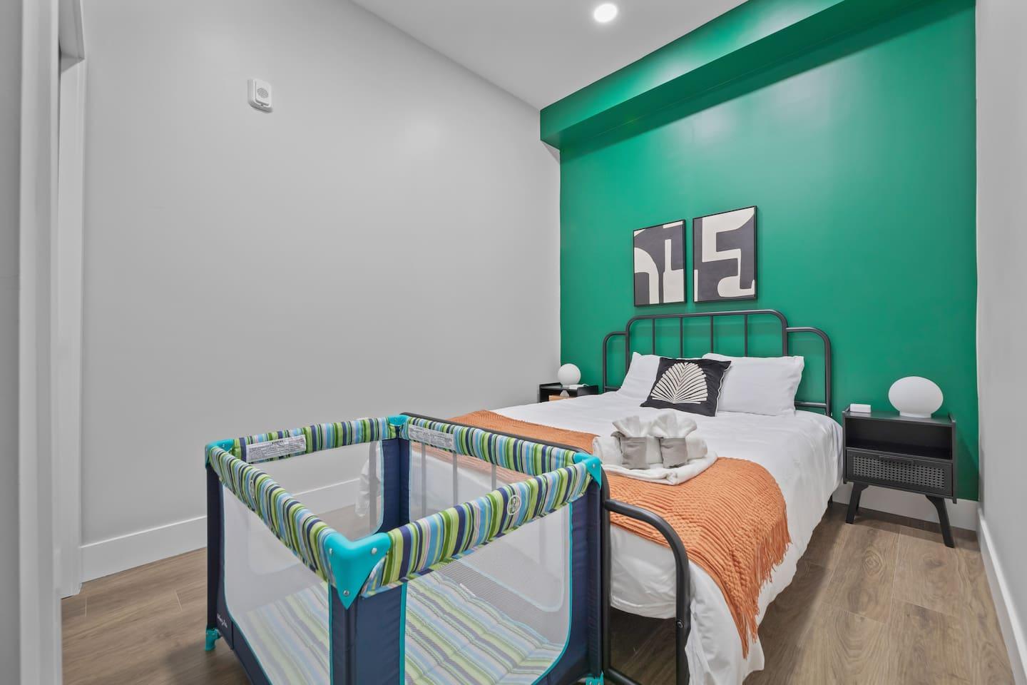 This bedroom is furnished with a crib, which makes it ideal for a family with a young child.