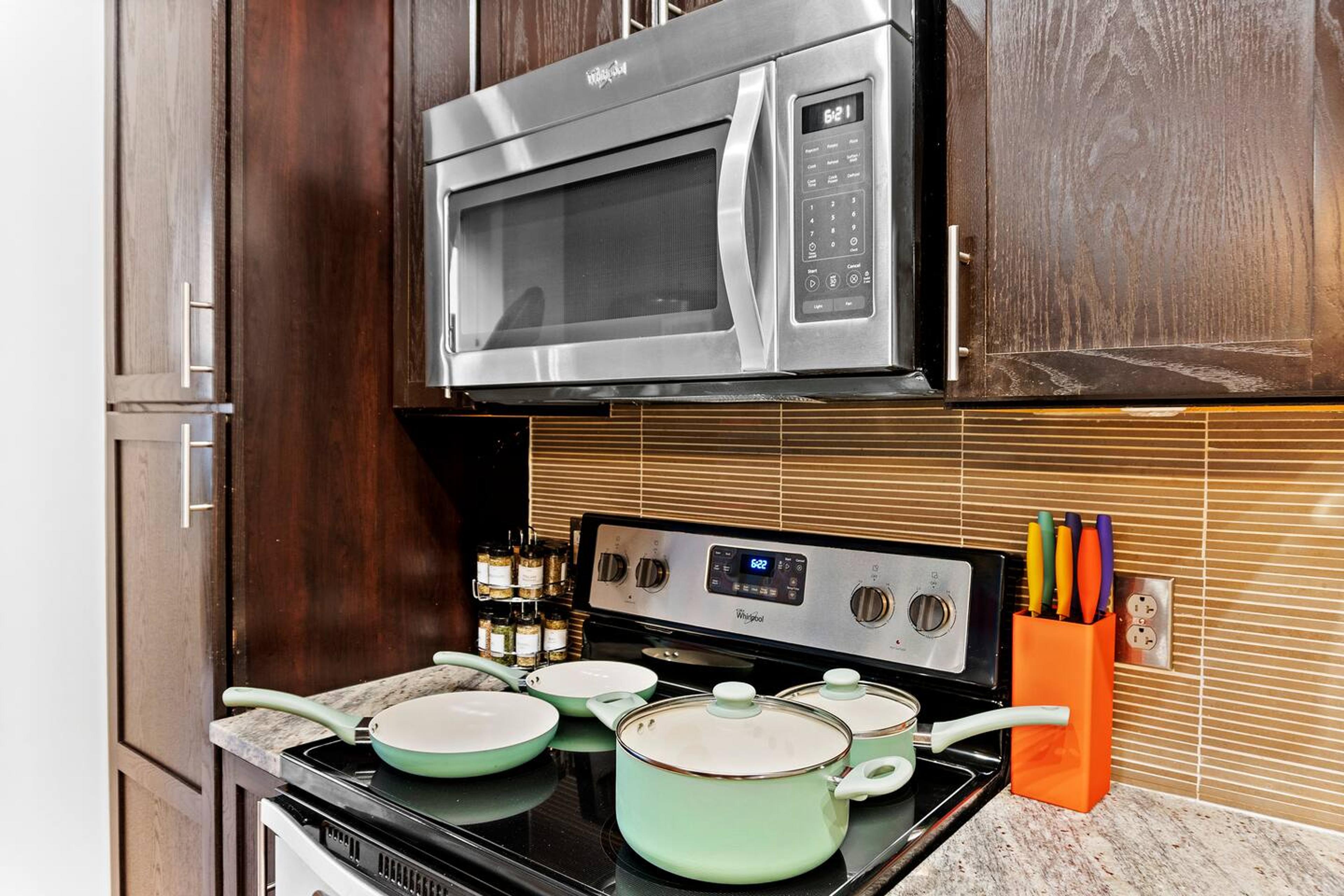 Our kitchen features a brand-new set of pots and pans, ready for your culinary creations. ‍