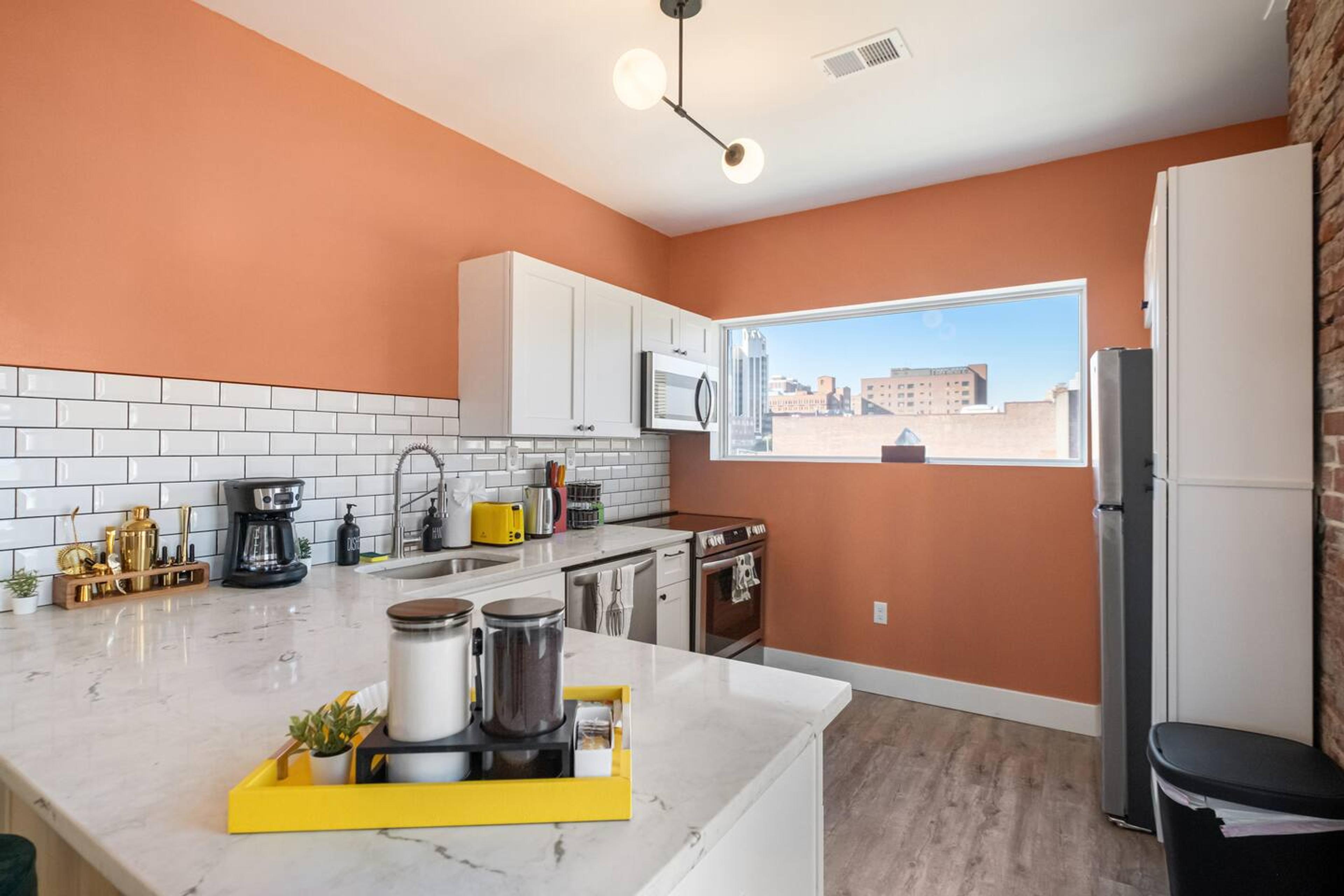 his dining room is perfect for entertaining. It has a large table that can seat 4 people comfortably with an attached sink. Also a cocktail mixer to find your hidden bartender skills!