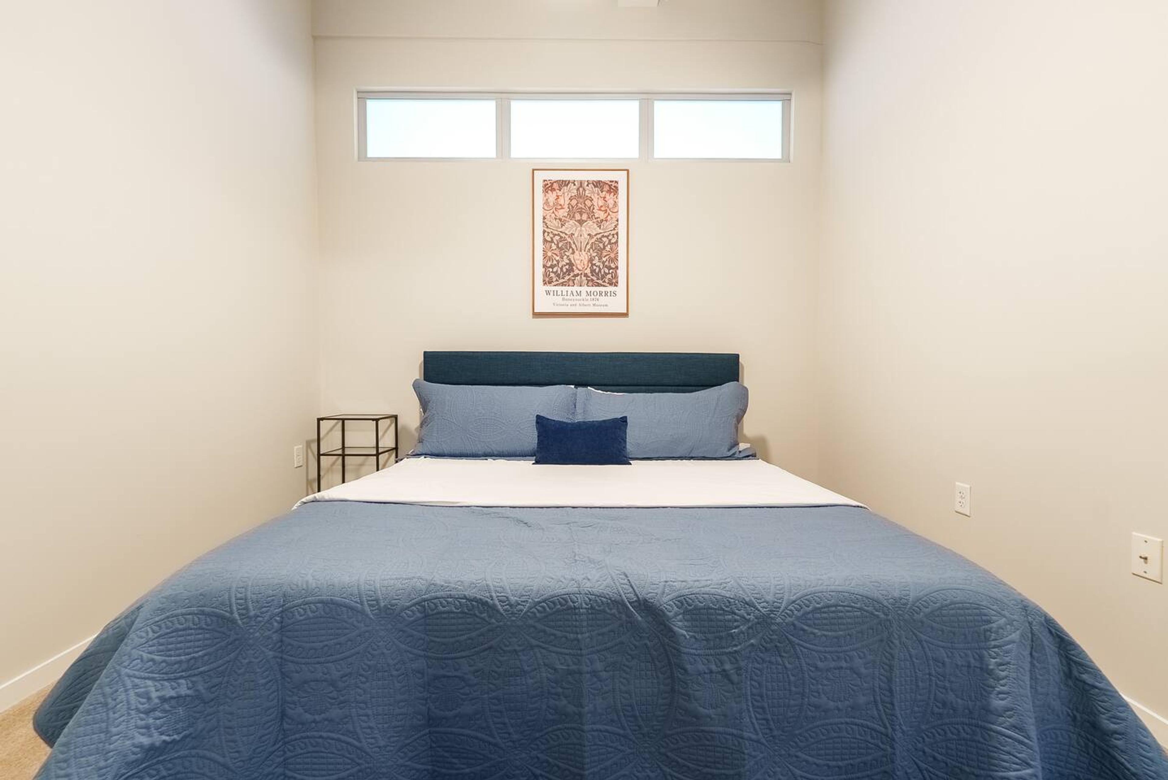 Comfortable king-size bed with fresh linens for a restful stay.